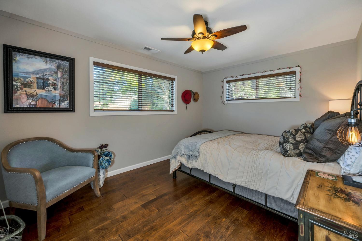 1389 Canyon Road Geyserville, CA 95441 - Photo 22 of 48 a bedroom with a bed and a couch