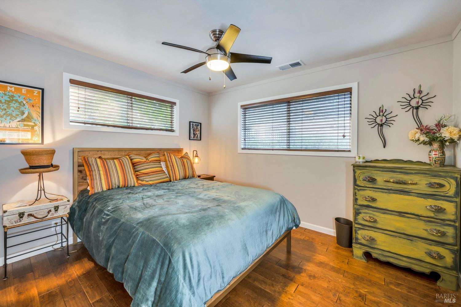 1389 Canyon Road Geyserville, CA 95441 - Photo 23 of 48 a bedroom with a bed and a chandelier