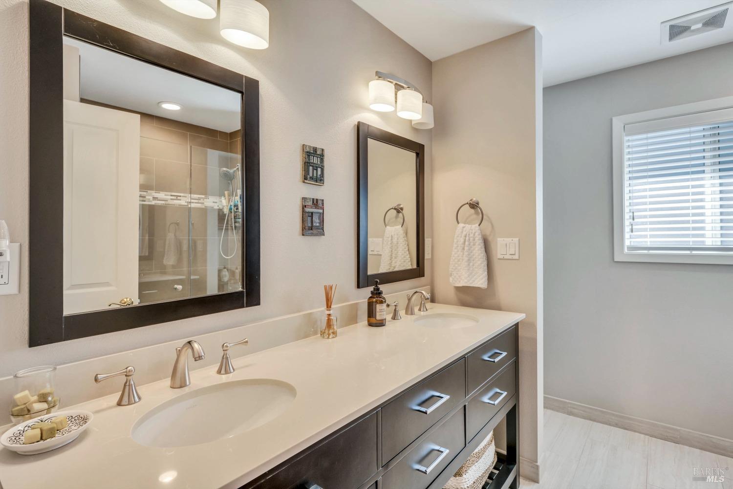 1389 Canyon Road Geyserville, CA 95441 - Photo 24 of 48 a bathroom with a double vanity sink mirror and next