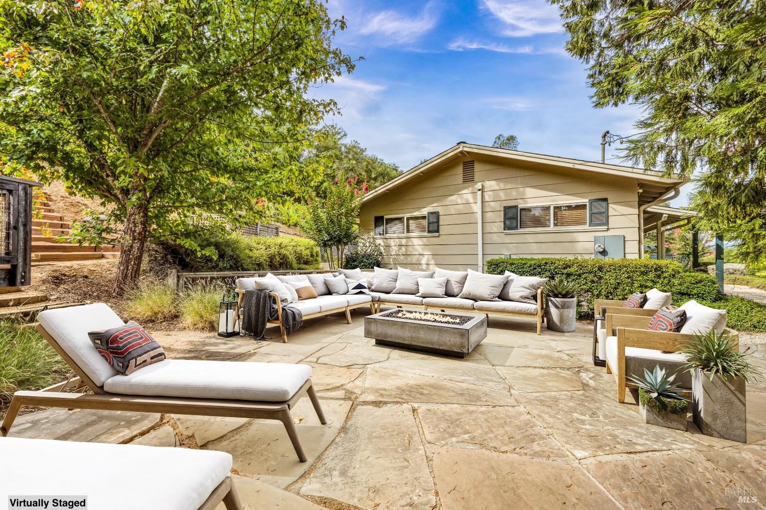 1389 Canyon Road Geyserville, CA 95441 - Photo 29 of 48 a view of a patio with couches and a table and chairs with wooden fence