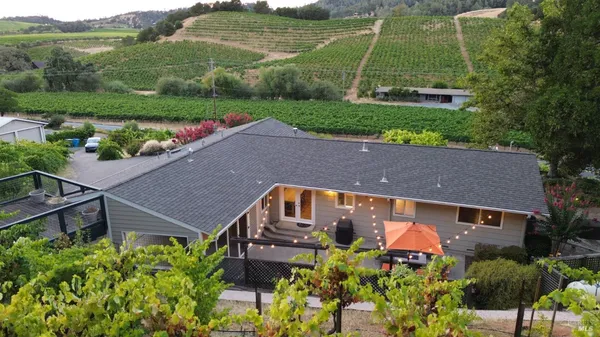 a view of a lake with a table and chairs