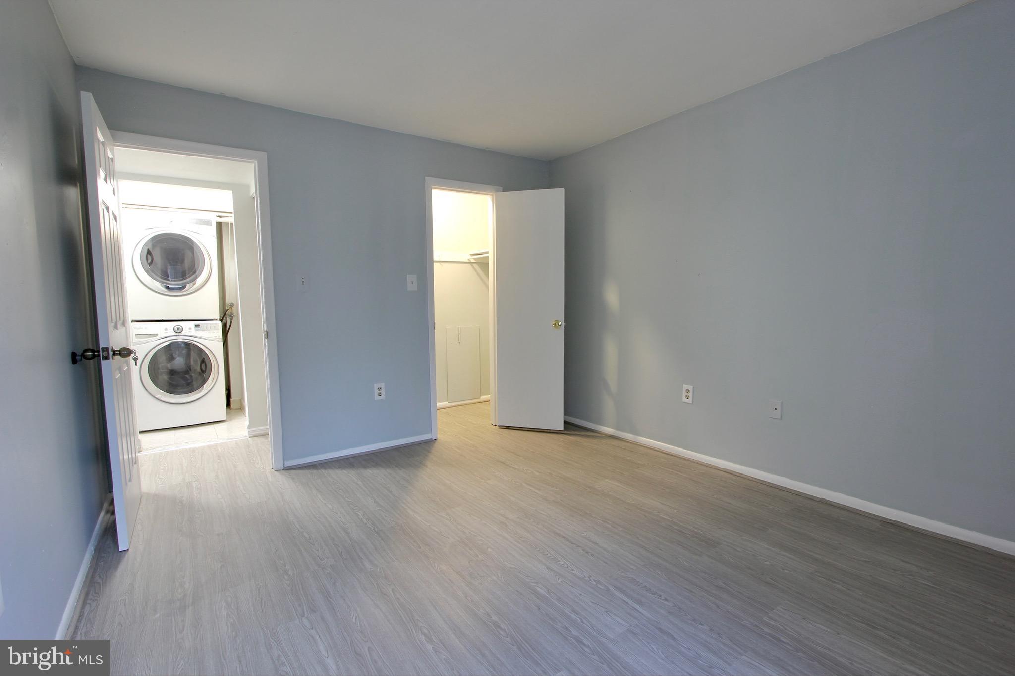 14426 Parkvale Road, Unit 5 Rockville, MD 20853 - Photo 18 of 26 a view of a hallway with wooden floor and utility room