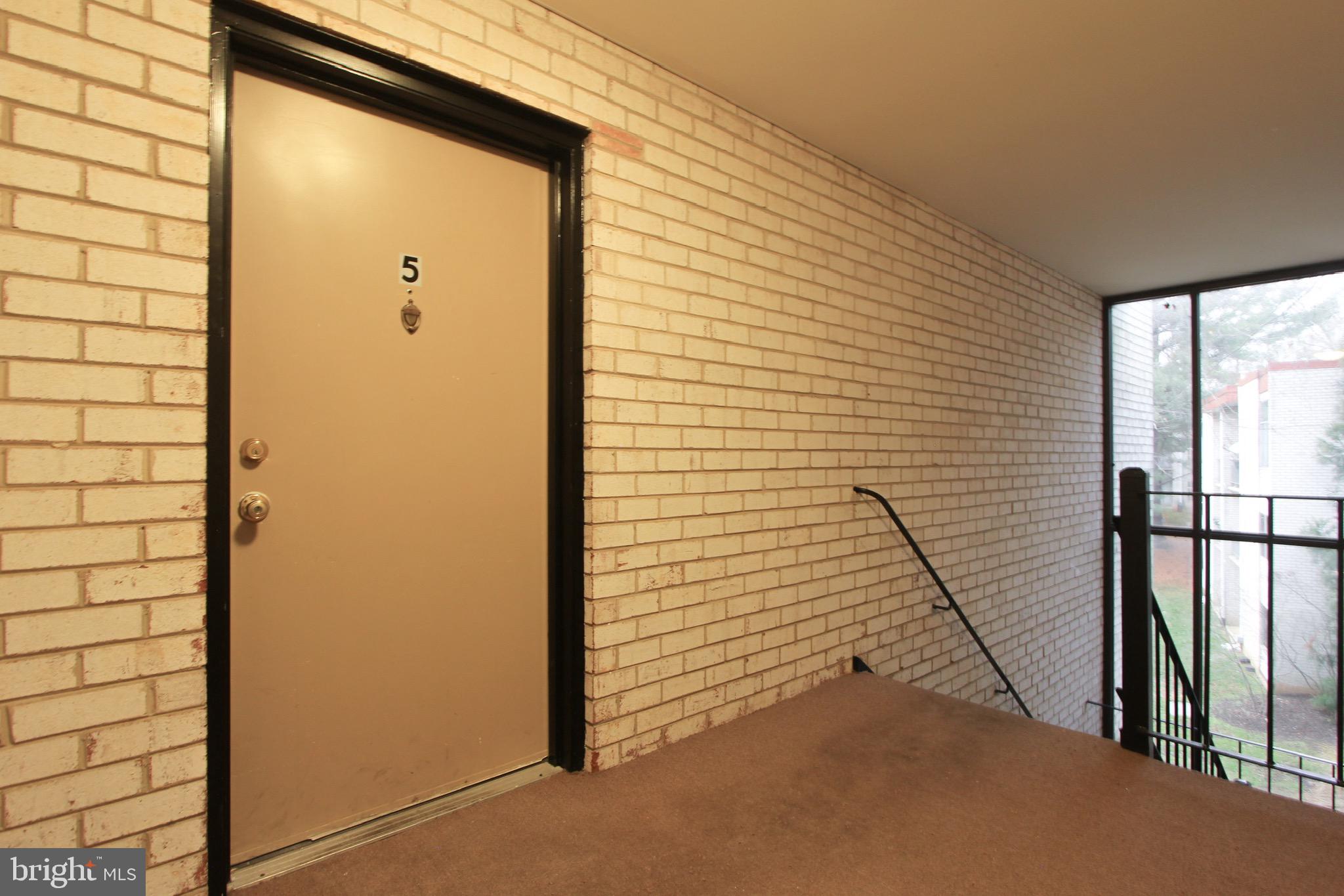 14426 Parkvale Road, Unit 5 Rockville, MD 20853 - Photo 2 of 26 a view of a door and wooden floor