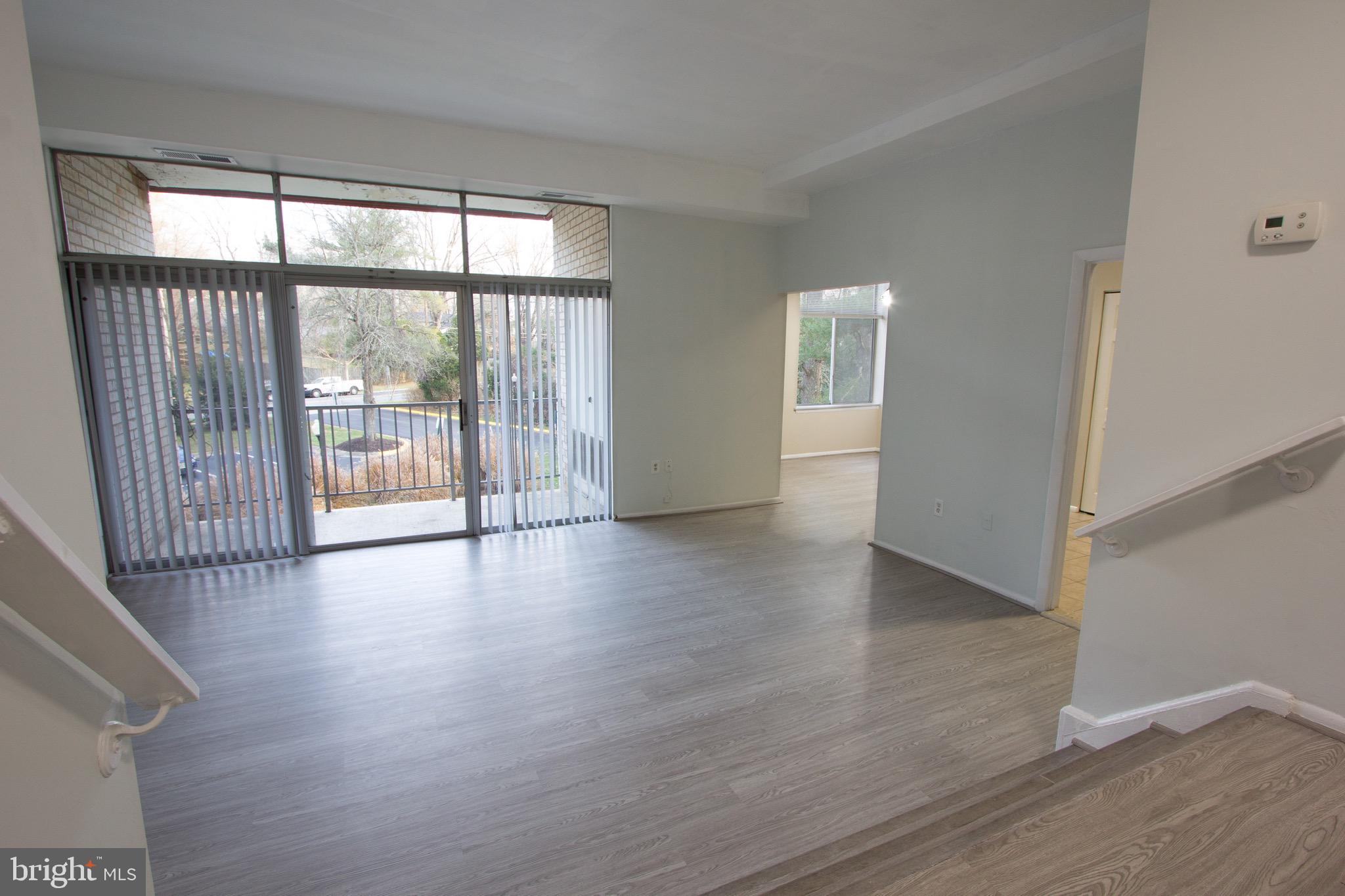 14426 Parkvale Road, Unit 5 Rockville, MD 20853 - Photo 5 of 26 wooden floor in an empty room with a window