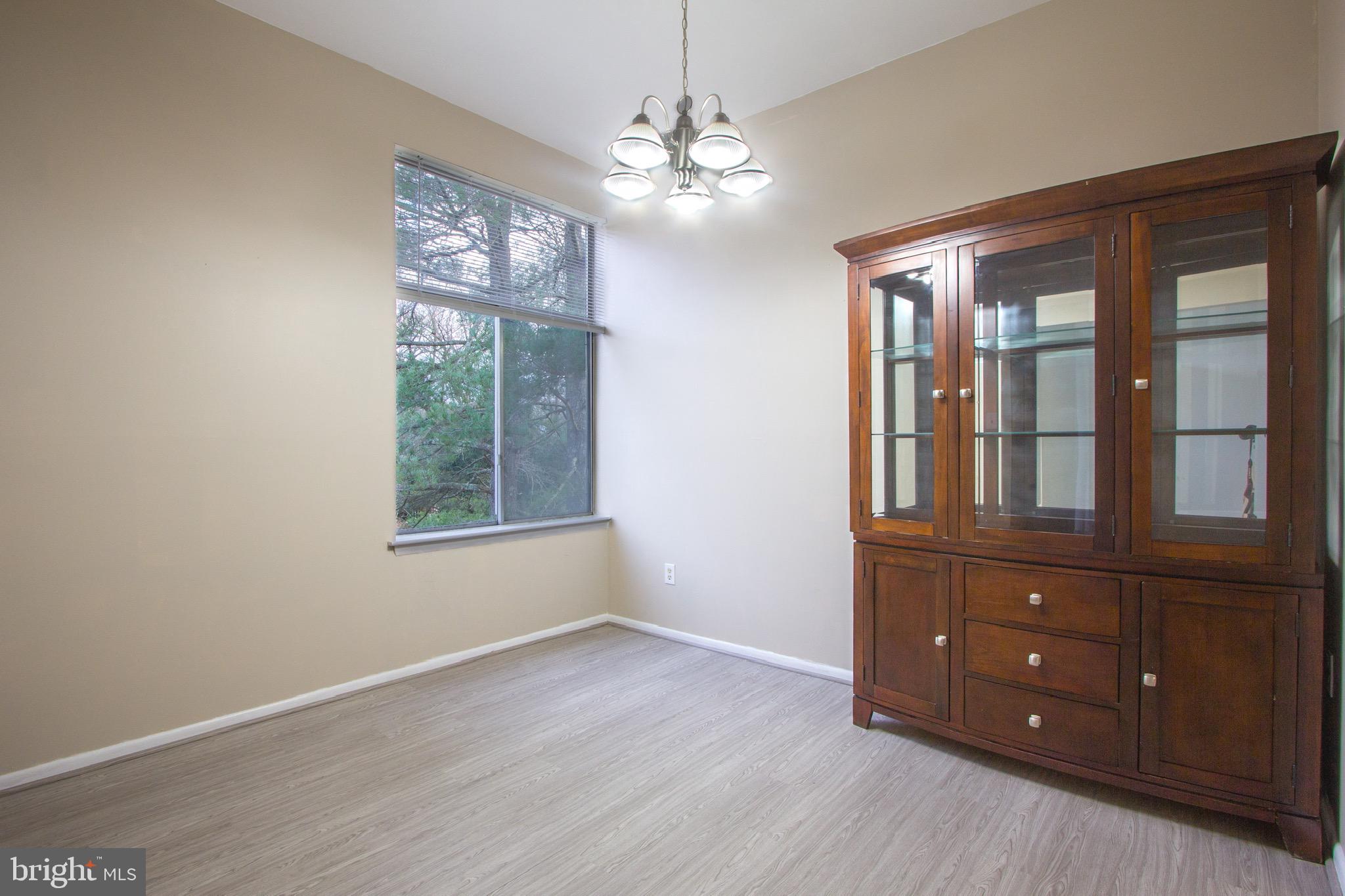 14426 Parkvale Road, Unit 5 Rockville, MD 20853 - Photo 8 of 26 a view of a windows and chandelier fan in a room