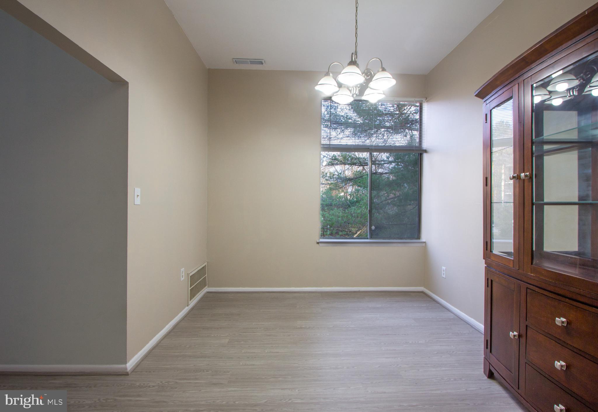 14426 Parkvale Road, Unit 5 Rockville, MD 20853 - Photo 9 of 26 a view of a windows and chandelier in a room