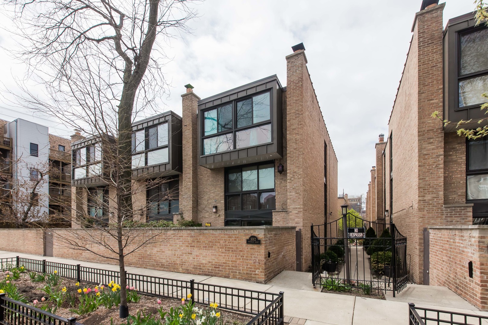3012 North Waterloo Court, Unit 5 Chicago, IL 60657 - Photo 1 of 19 a front view of a building with street