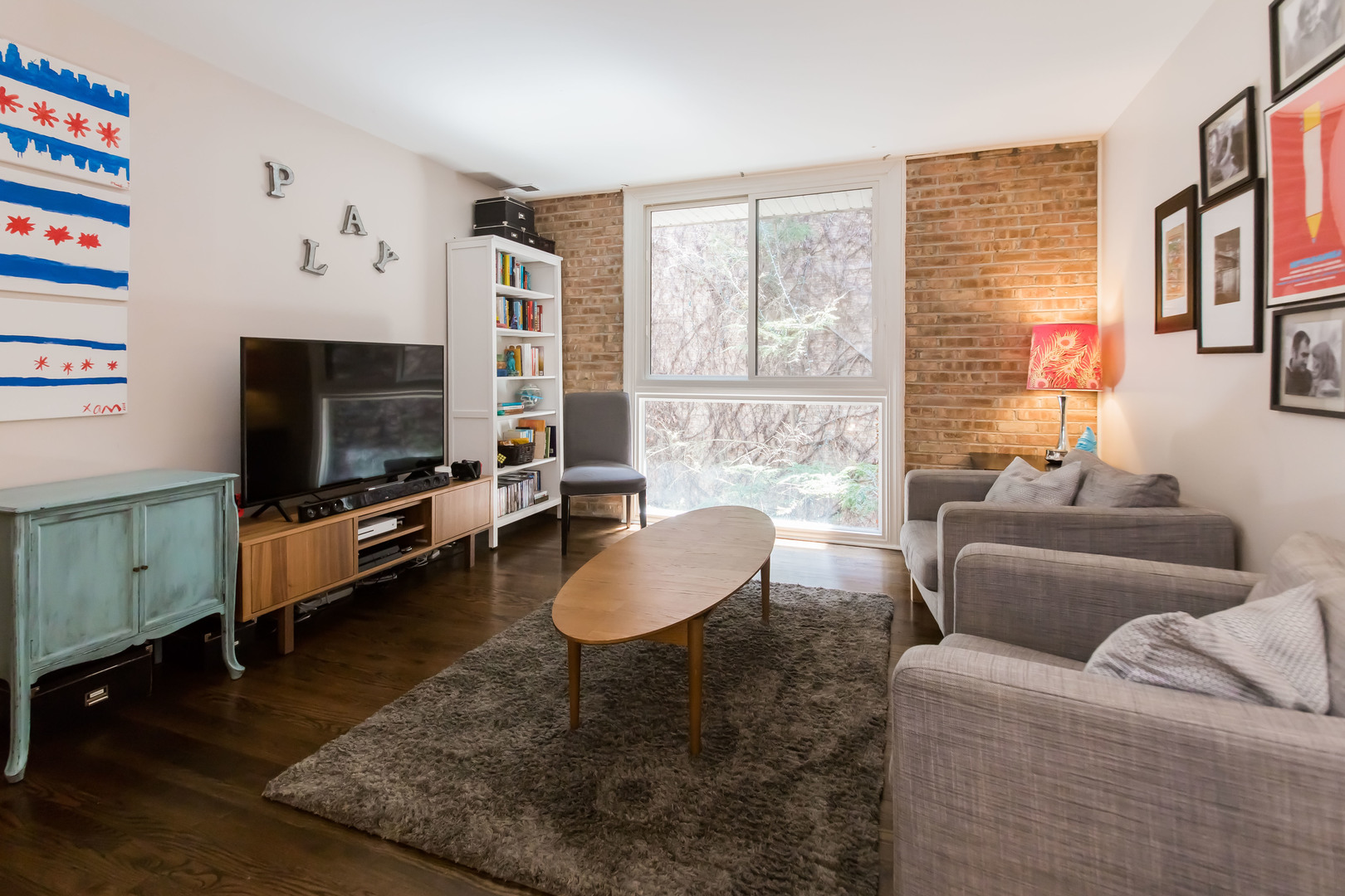 3012 North Waterloo Court, Unit 5 Chicago, IL 60657 - Photo 11 of 19 a living room with furniture and a flat screen tv