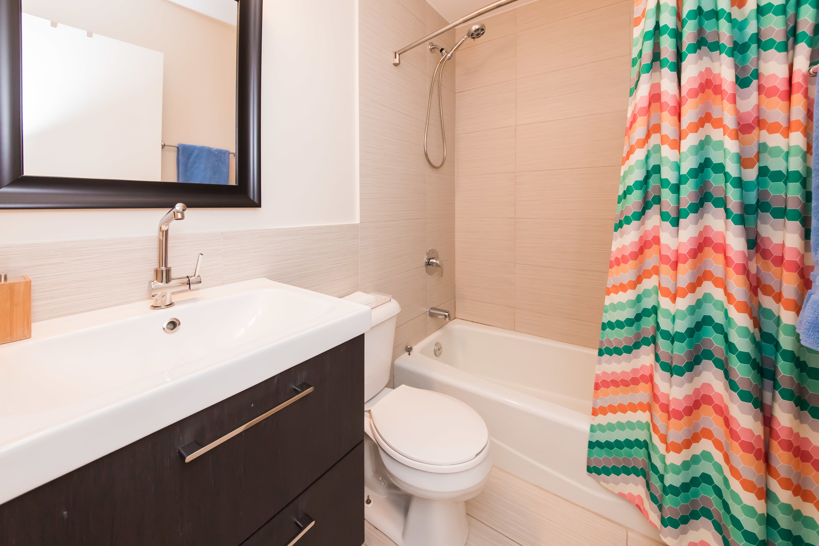 3012 North Waterloo Court, Unit 5 Chicago, IL 60657 - Photo 16 of 19 a bathroom with a sink mirror vanity and toilet