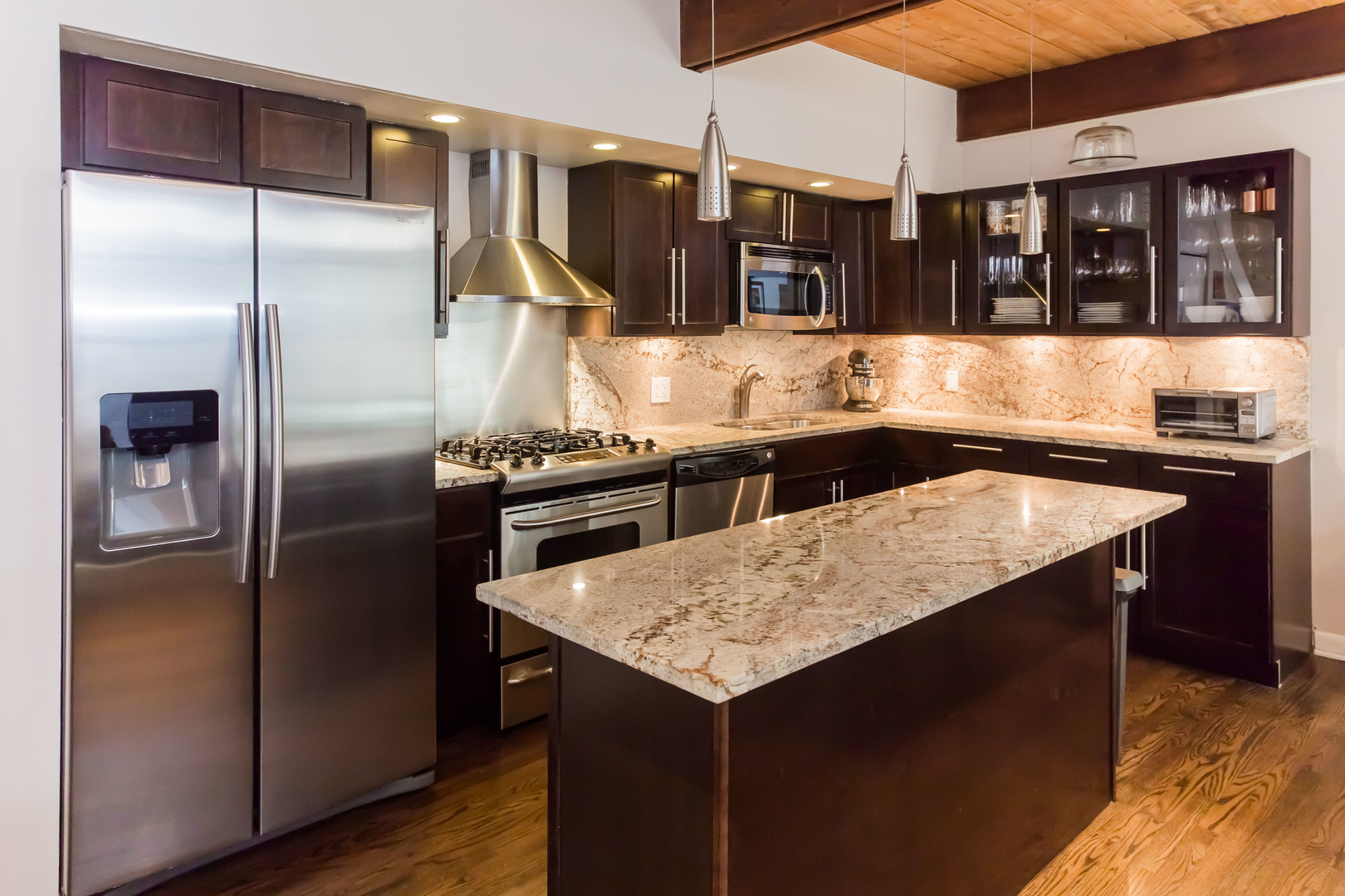 3012 North Waterloo Court, Unit 5 Chicago, IL 60657 - Photo 6 of 19 a kitchen with a refrigerator and a sink