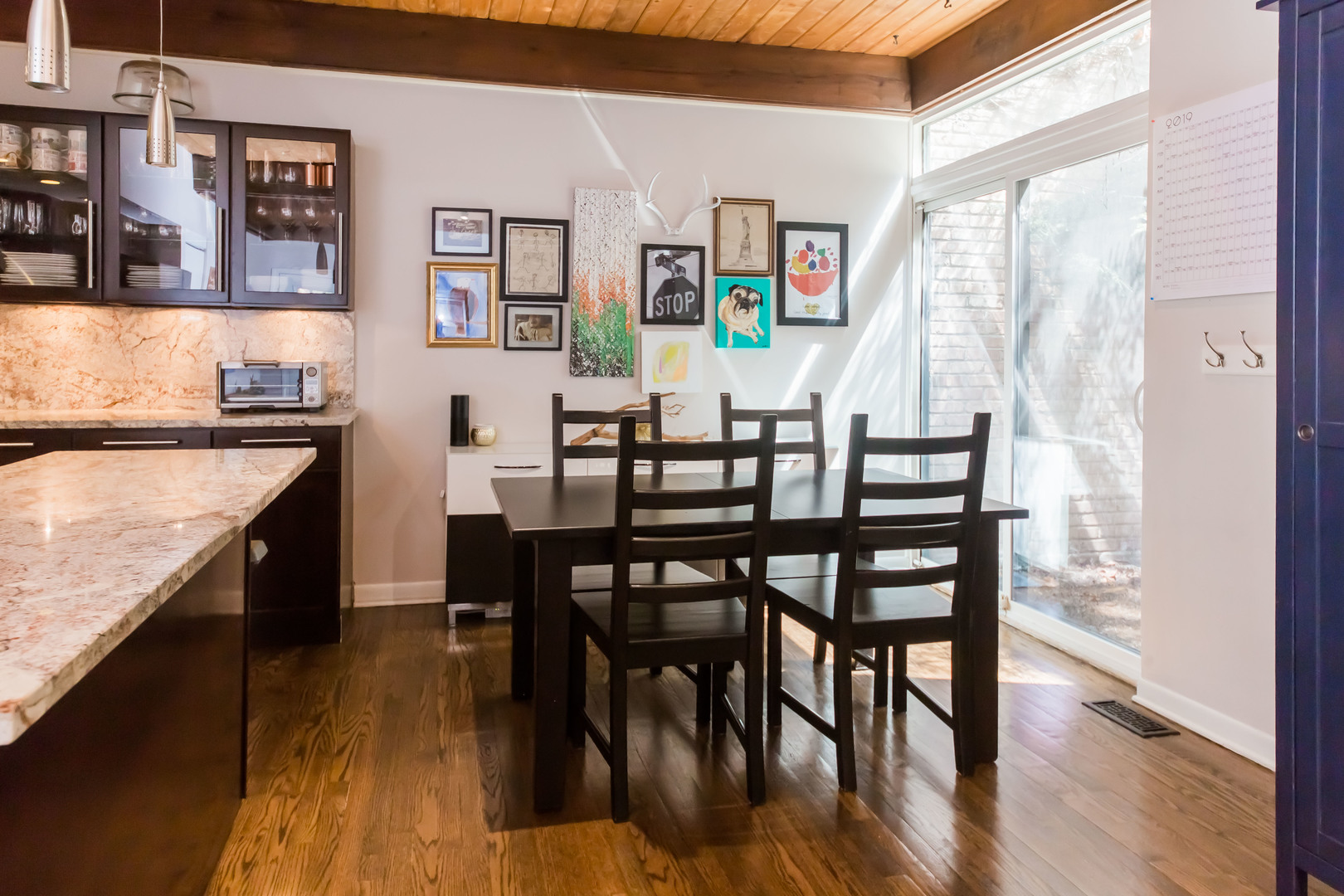 3012 North Waterloo Court, Unit 5 Chicago, IL 60657 - Photo 8 of 19 a dining room with furniture and wooden floor