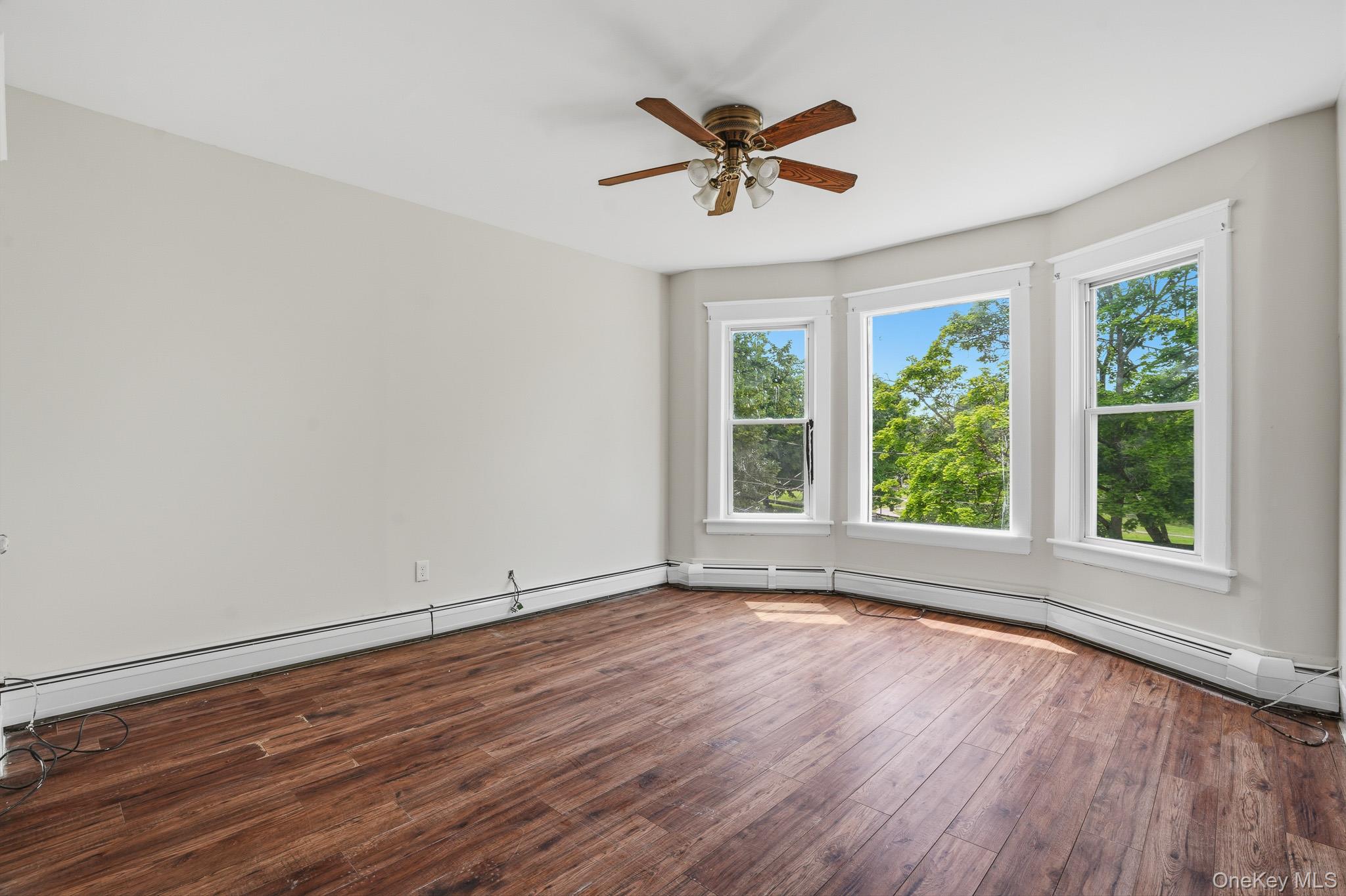65 North Clinton Street Poughkeepsie, NY 12601 - Photo 26 of 43 a view of empty room with wooden floor and fan
