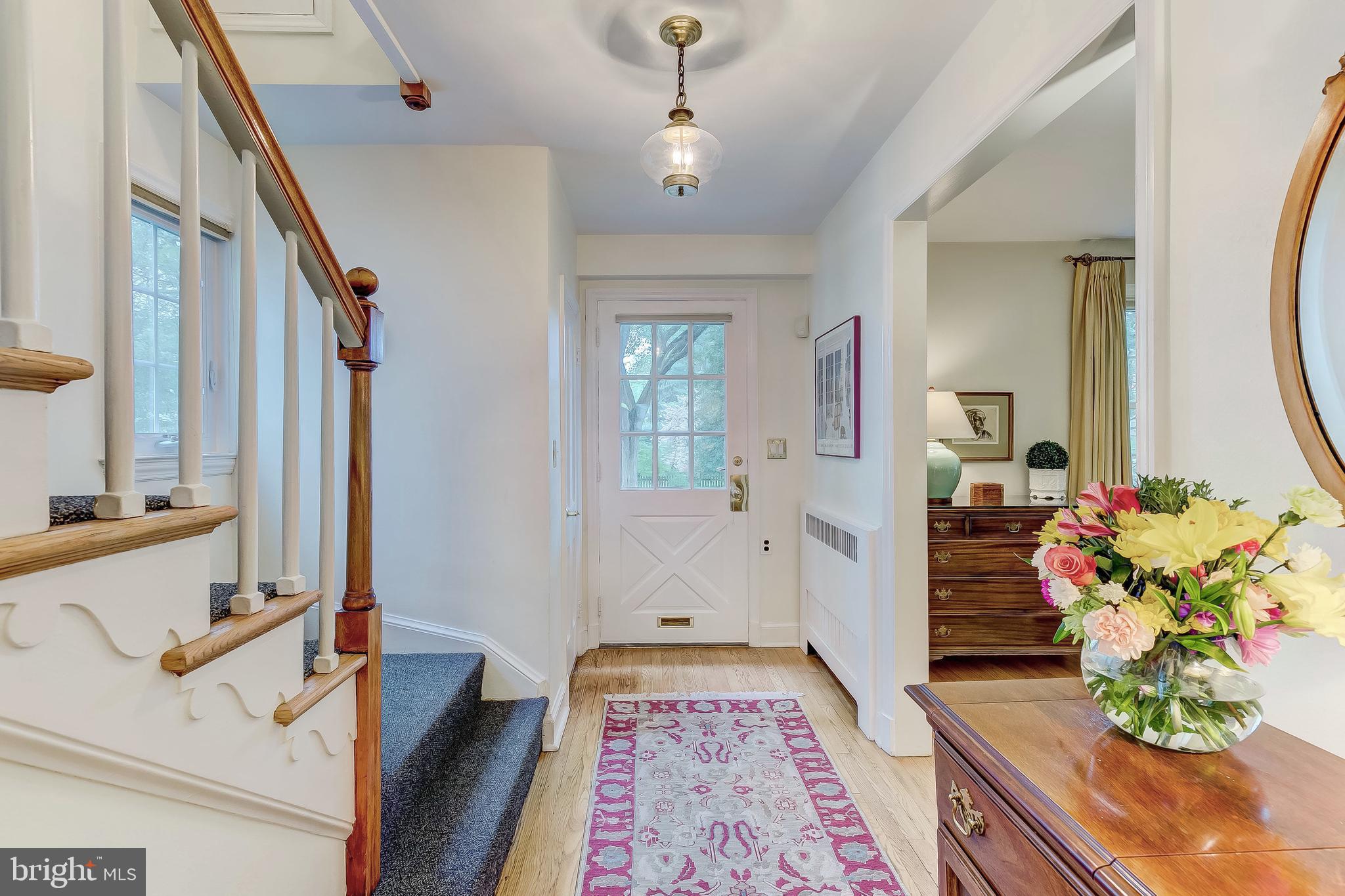 5704 Kenmore Road Baltimore, MD 21210 - Photo 2 of 30 a hallway with wooden floor and furniture
