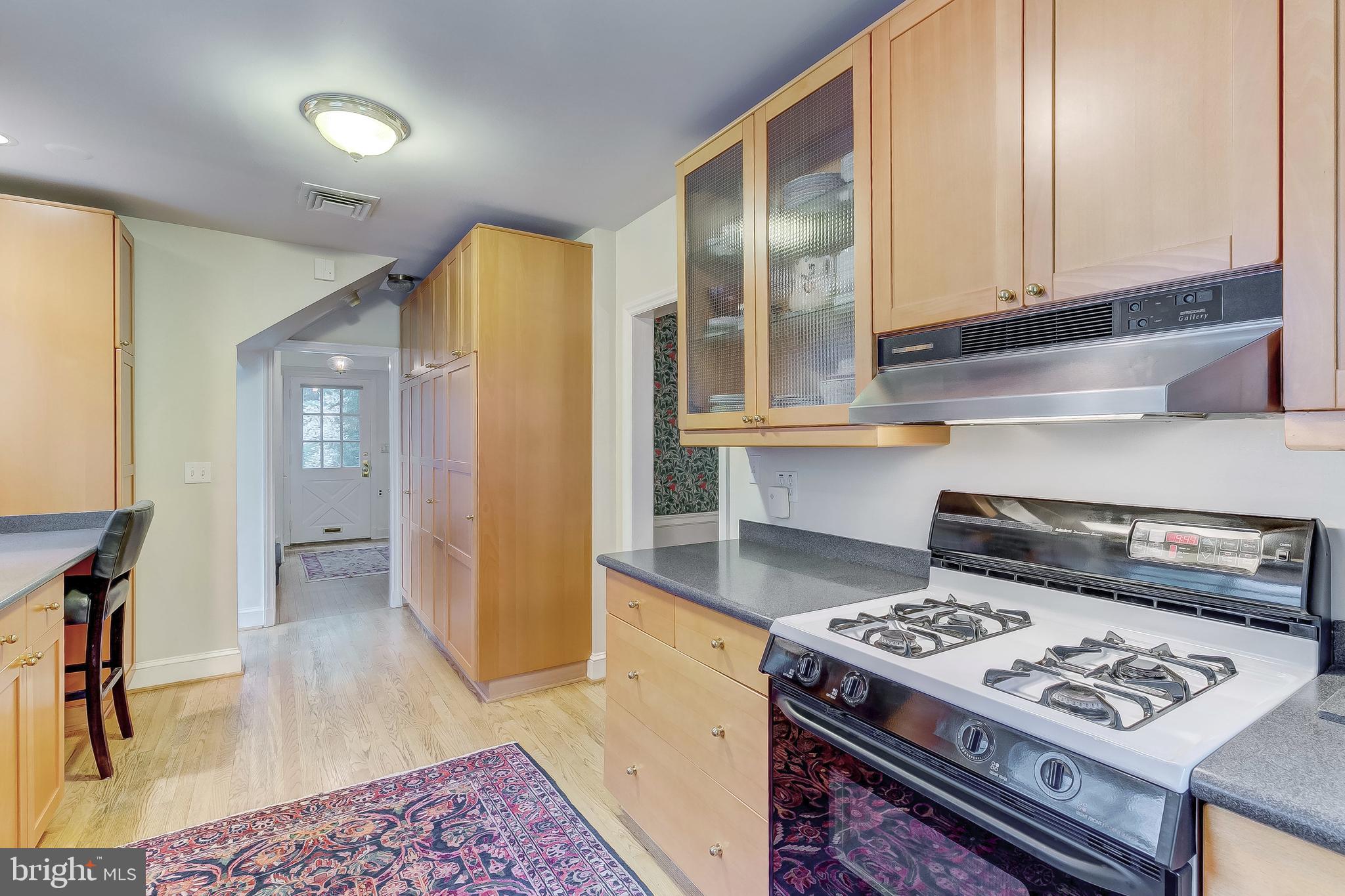5704 Kenmore Road Baltimore, MD 21210 - Photo 11 of 30 a kitchen with a stove and a refrigerator