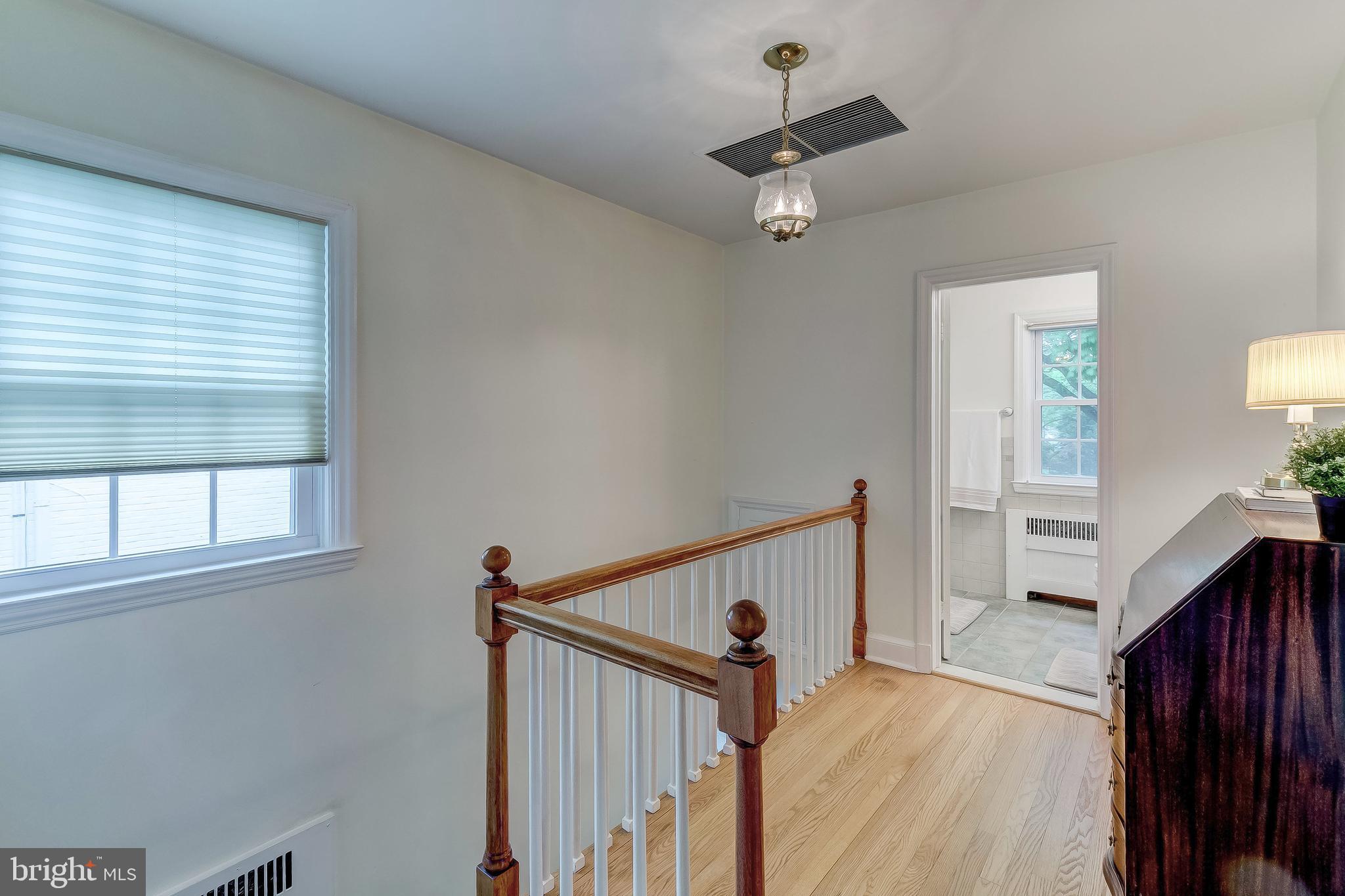 5704 Kenmore Road Baltimore, MD 21210 - Photo 13 of 30 a view of a hallway with a window and stairs