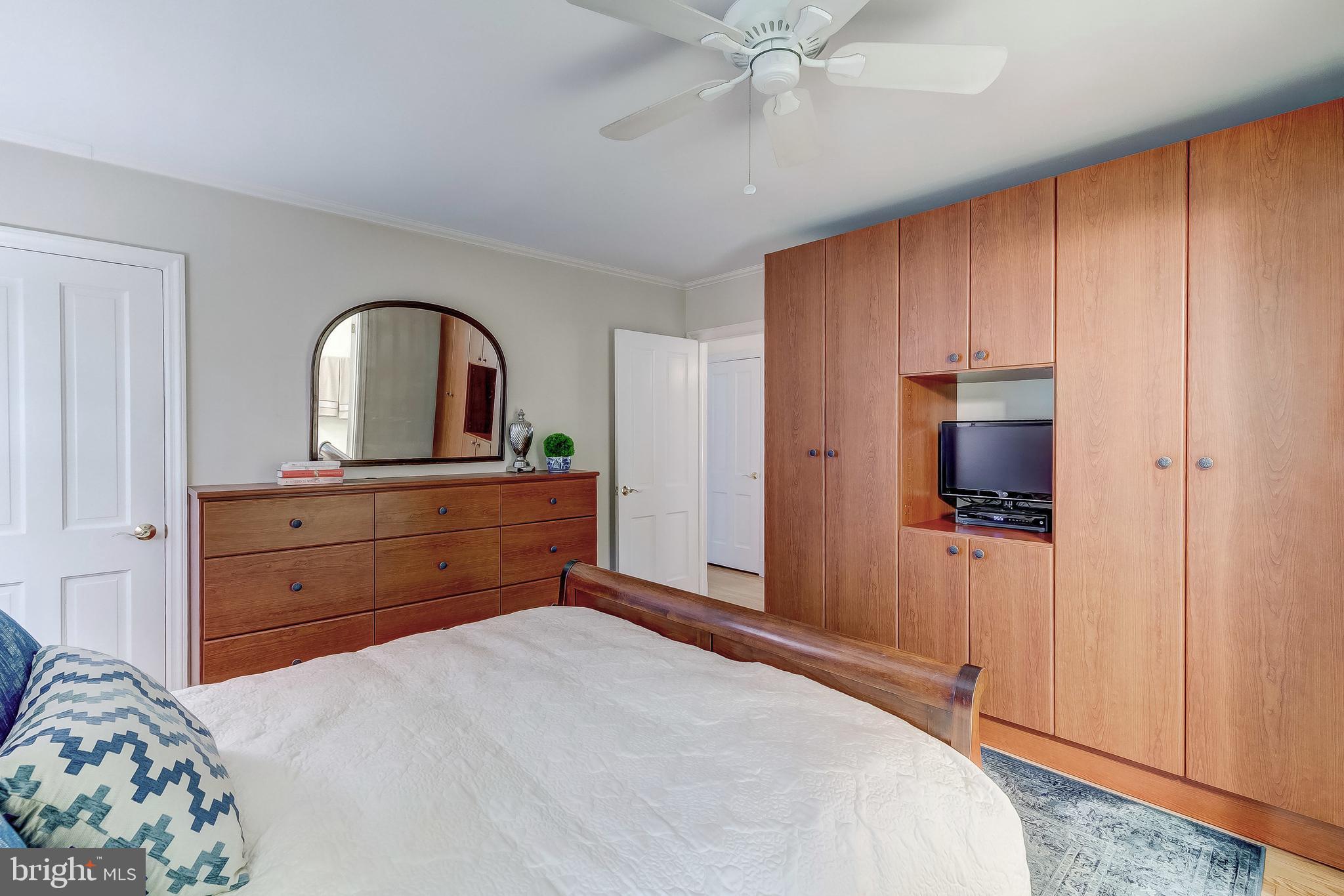 5704 Kenmore Road Baltimore, MD 21210 - Photo 17 of 30 a bedroom with a bed and a dresser
