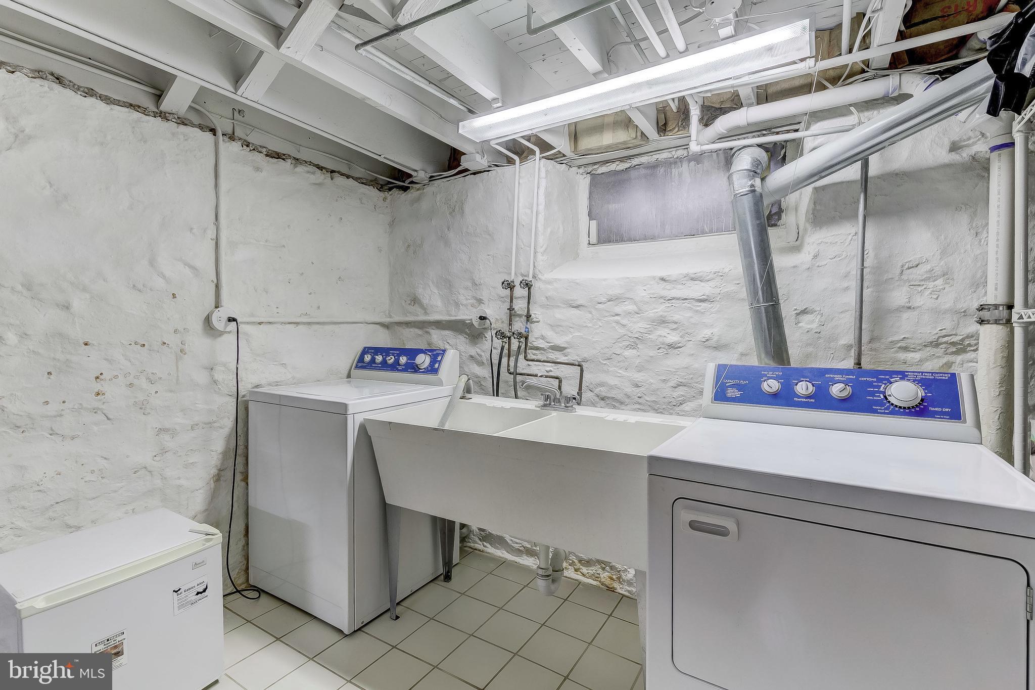 5704 Kenmore Road Baltimore, MD 21210 - Photo 23 of 30 a bathroom with a sink and a mirror