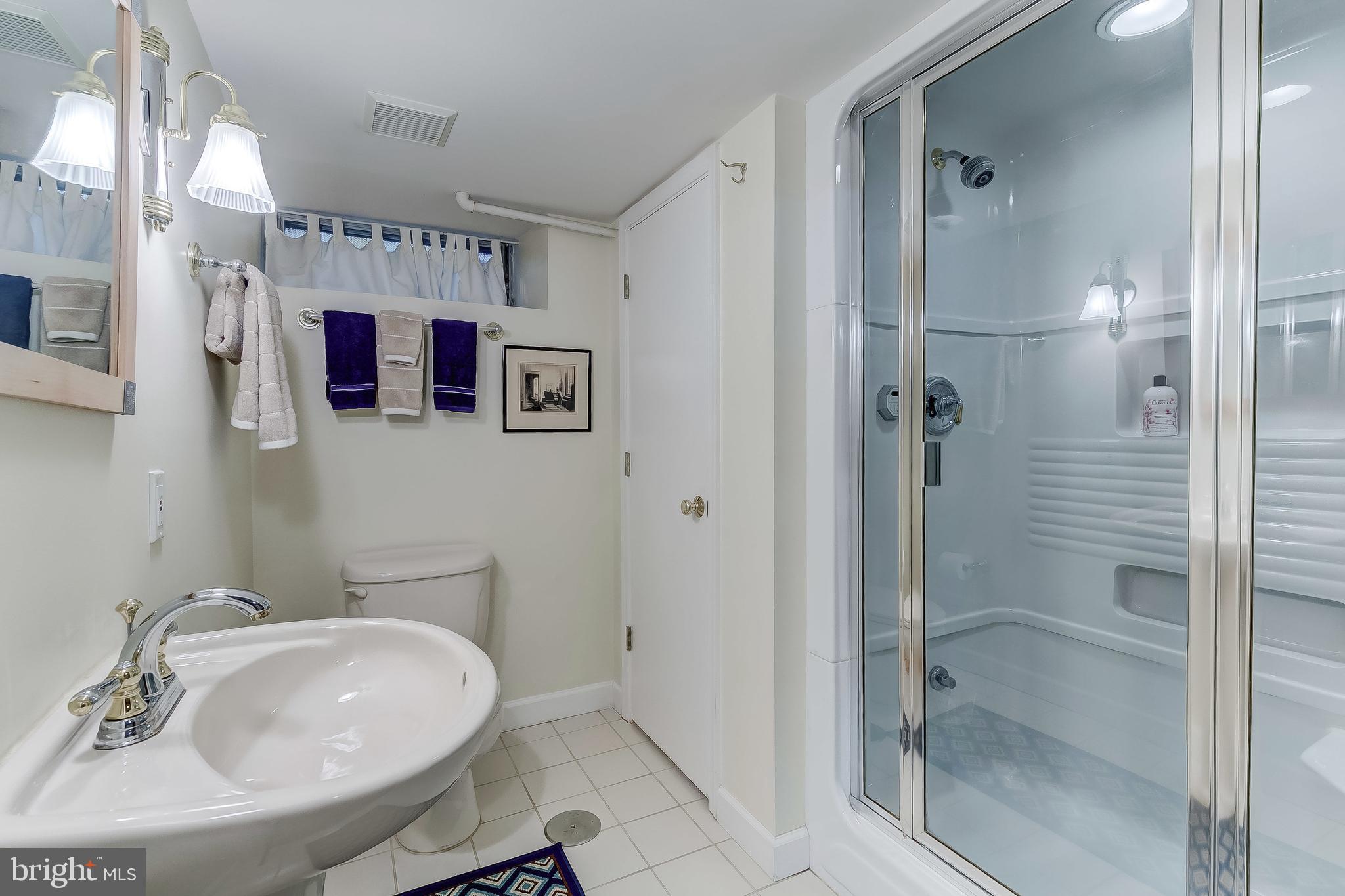 5704 Kenmore Road Baltimore, MD 21210 - Photo 24 of 30 a bathroom with a sink toilet and shower