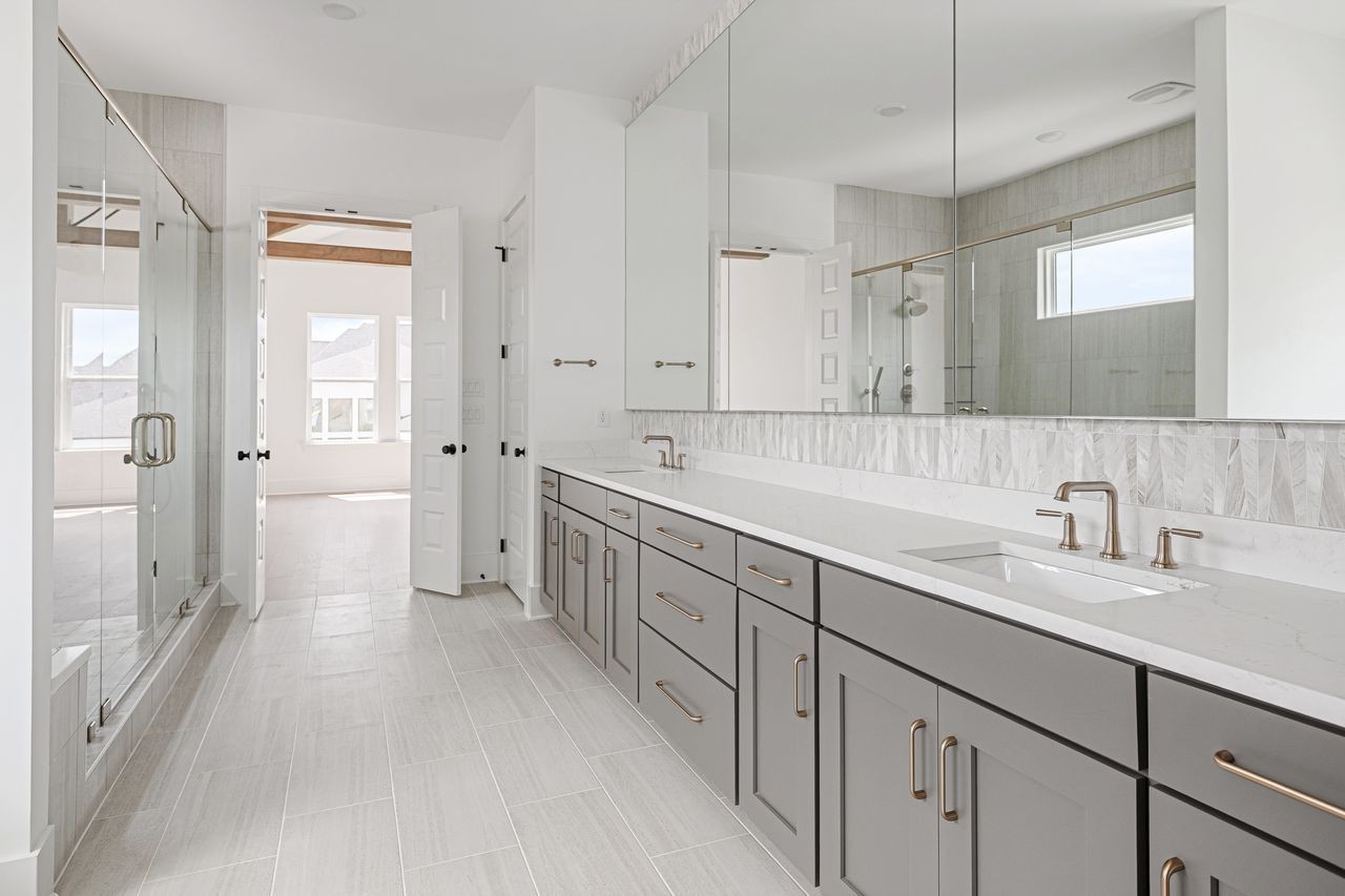 6065 Lookaway Circle Franklin, TN 37067 - Photo 28 of 39 a spacious bathroom with a double vanity sink mirror double and shower
