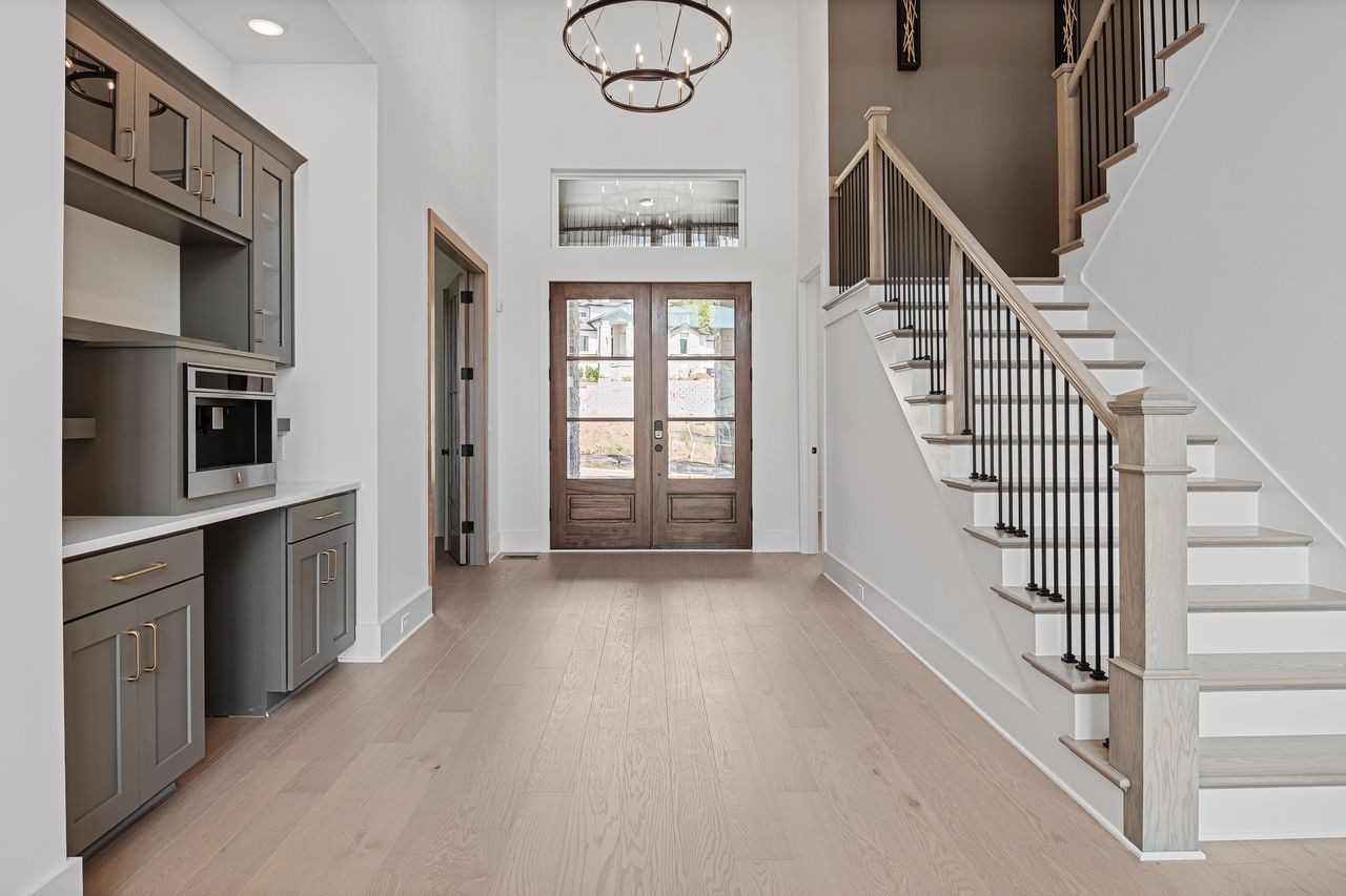 6065 Lookaway Circle Franklin, TN 37067 - Photo 5 of 39 a view of an entryway with wooden floor and windows