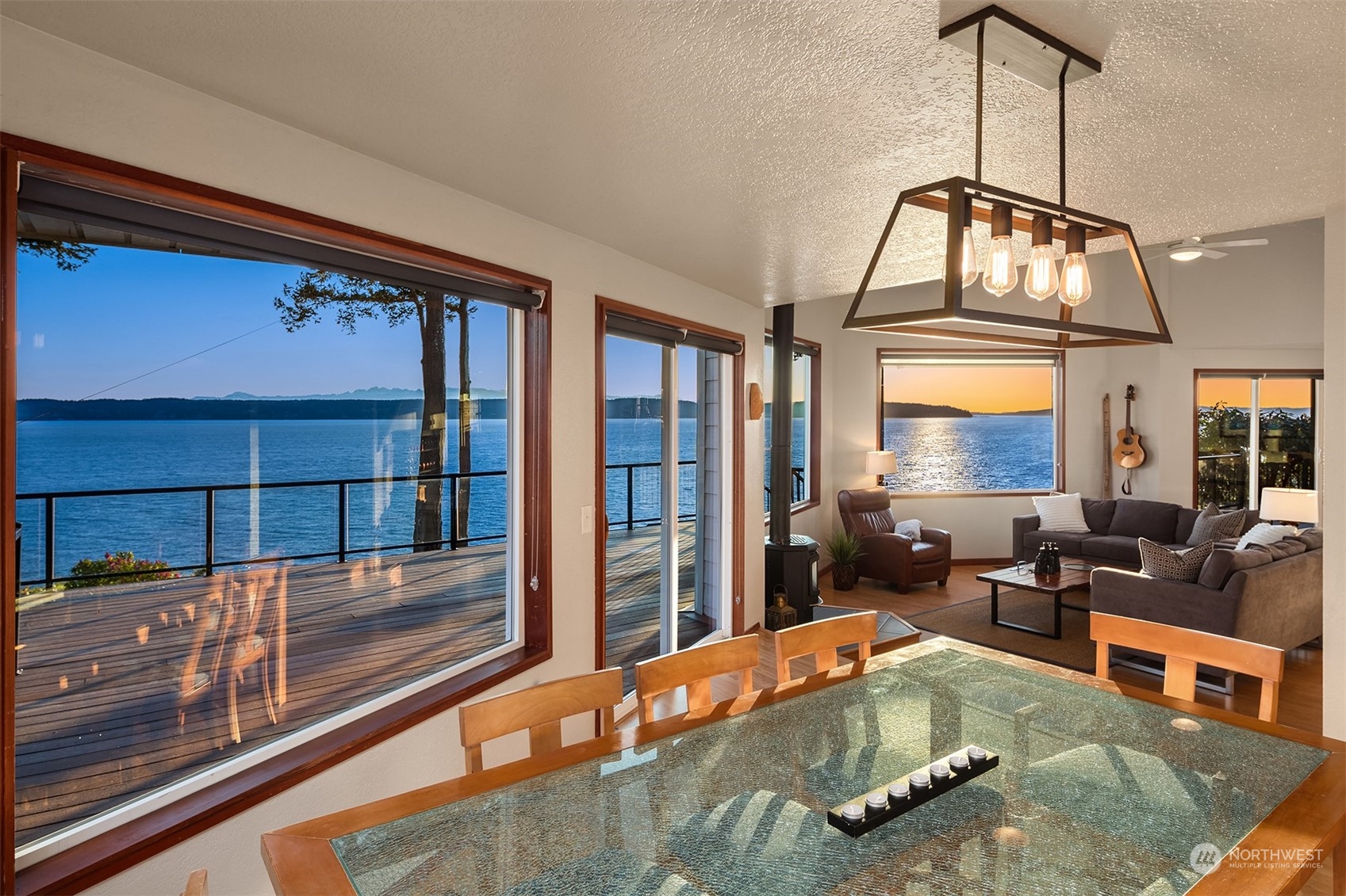 3480 Timothy Way Camano Island, WA 98282 - Photo 11 of 39 a living room with fireplace furniture and a floor to ceiling window