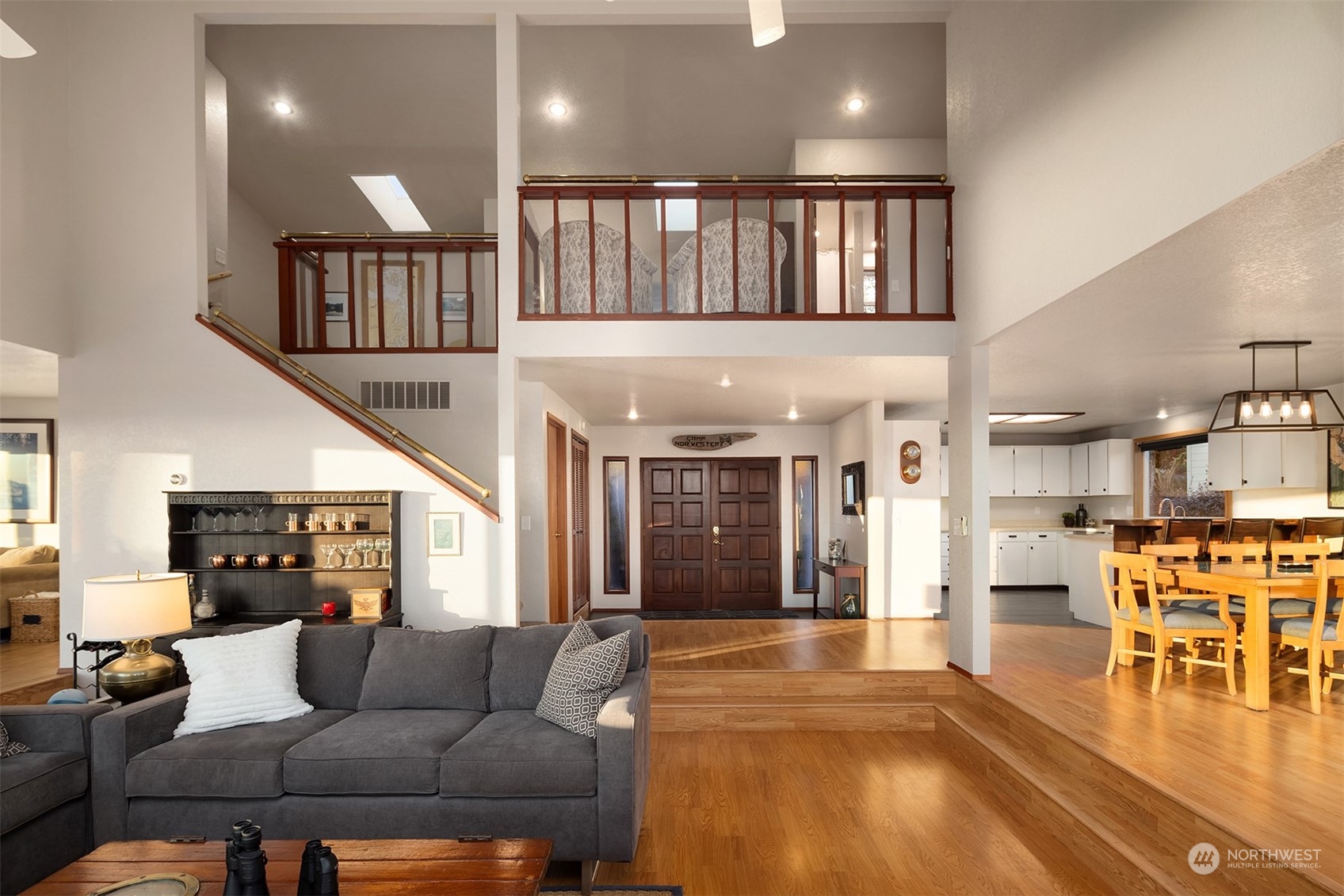 3480 Timothy Way Camano Island, WA 98282 - Photo 14 of 39 a living room with furniture wooden floor and a large window
