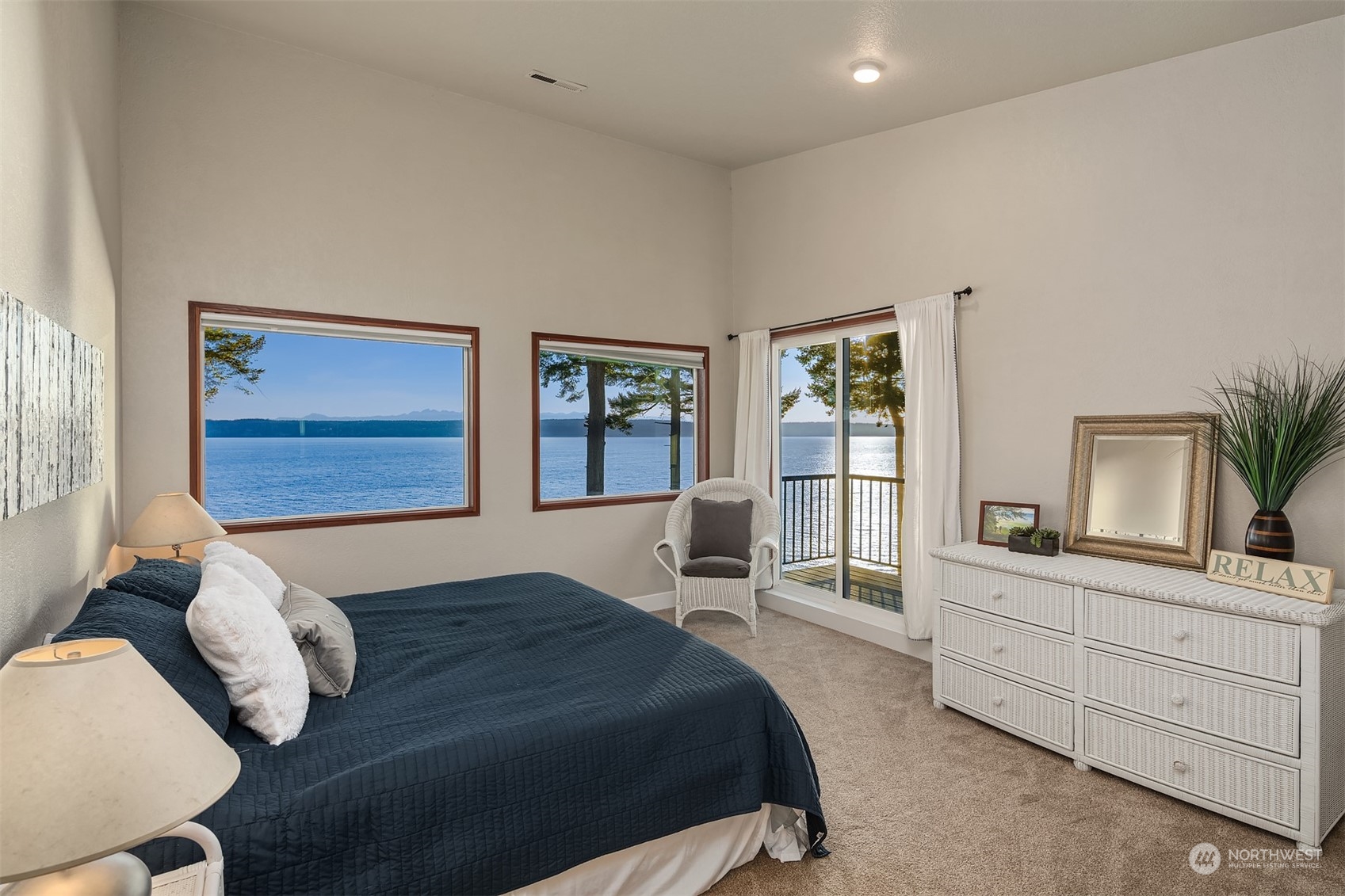 3480 Timothy Way Camano Island, WA 98282 - Photo 19 of 39 a bedroom with a bed and wooden floor