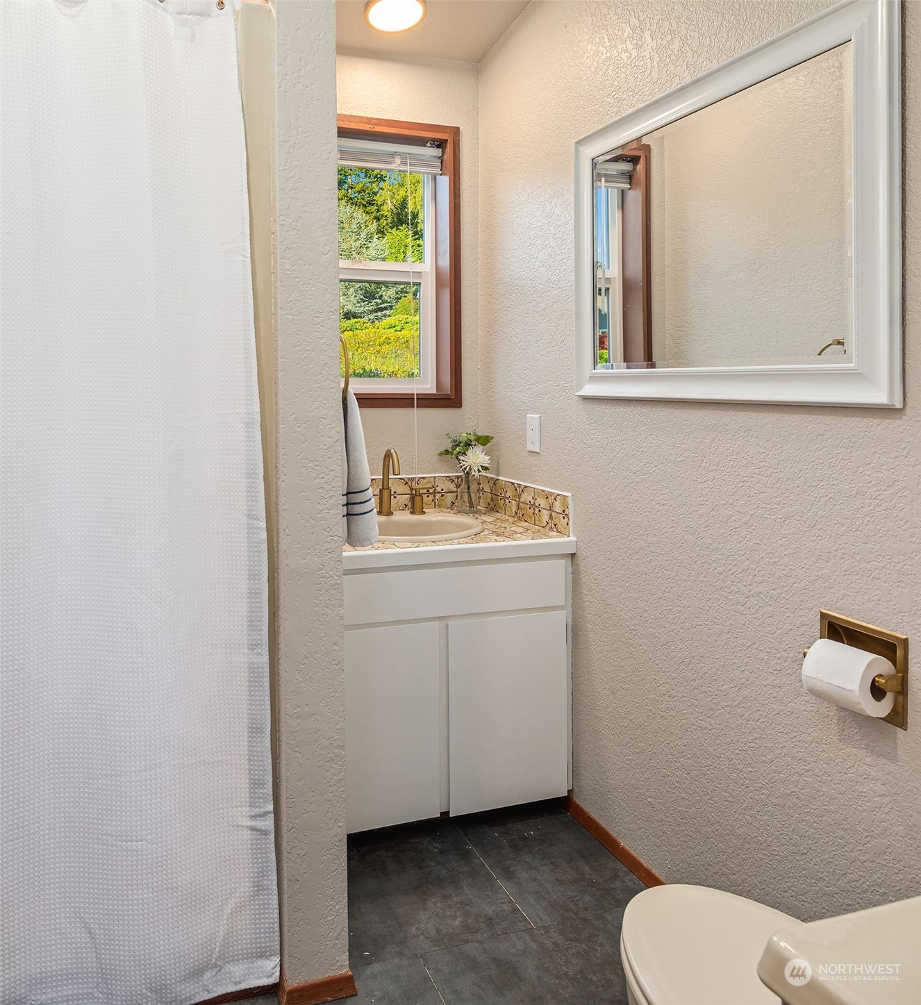 3480 Timothy Way Camano Island, WA 98282 - Photo 25 of 39 a bathroom with a toilet sink and mirror
