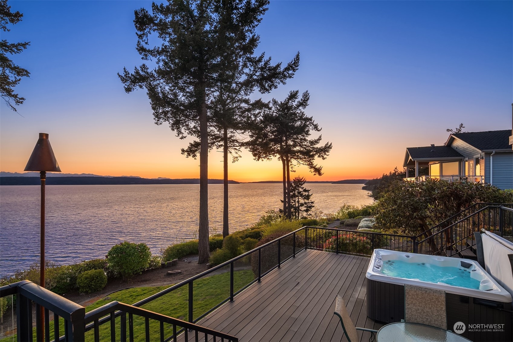 3480 Timothy Way Camano Island, WA 98282 - Photo 30 of 39 a view of a balcony with chairs and wooden floor