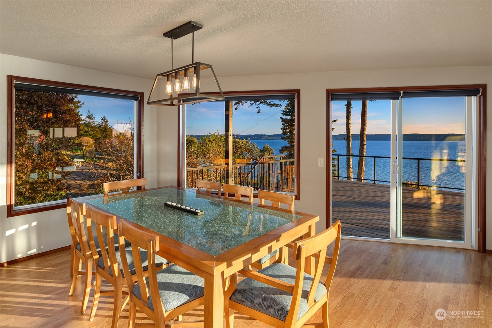3480 Timothy Way Camano Island, WA 98282 - Photo 4 of 39 a view of a dining room with furniture large window and wooden floor