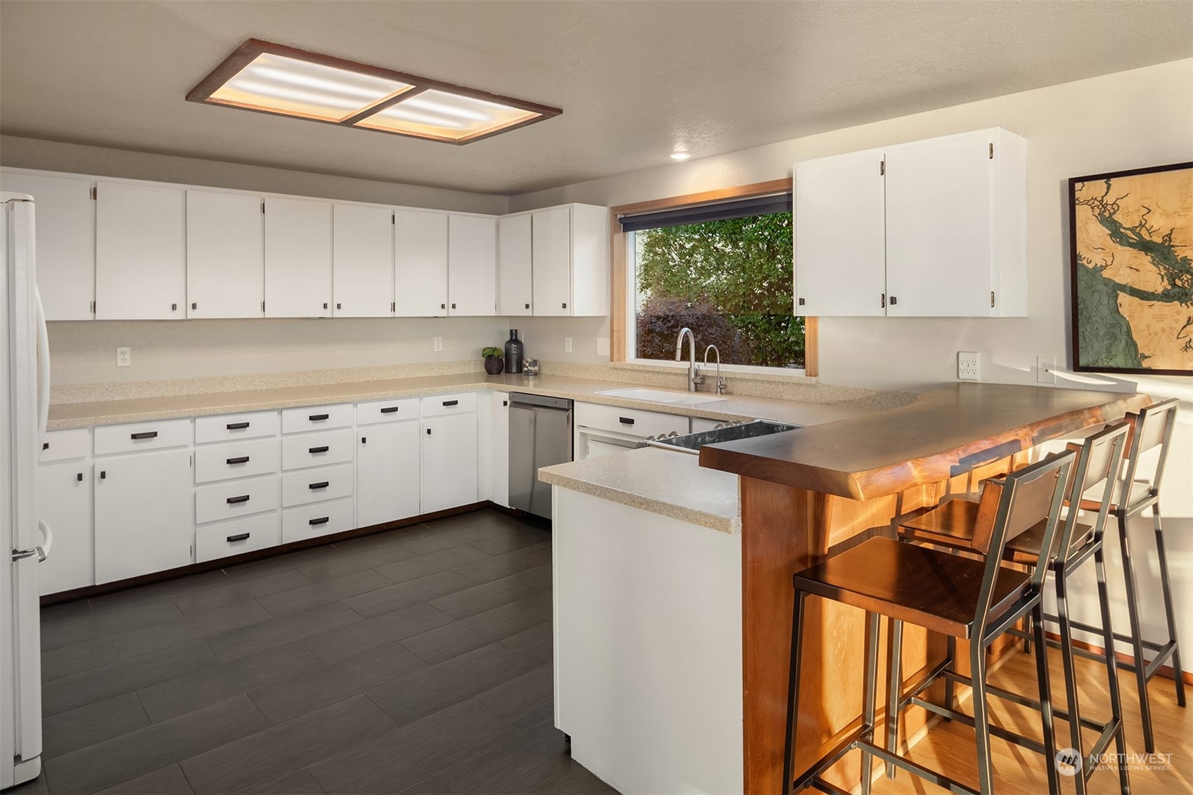 3480 Timothy Way Camano Island, WA 98282 - Photo 8 of 39 a kitchen with granite countertop white cabinets and white appliances