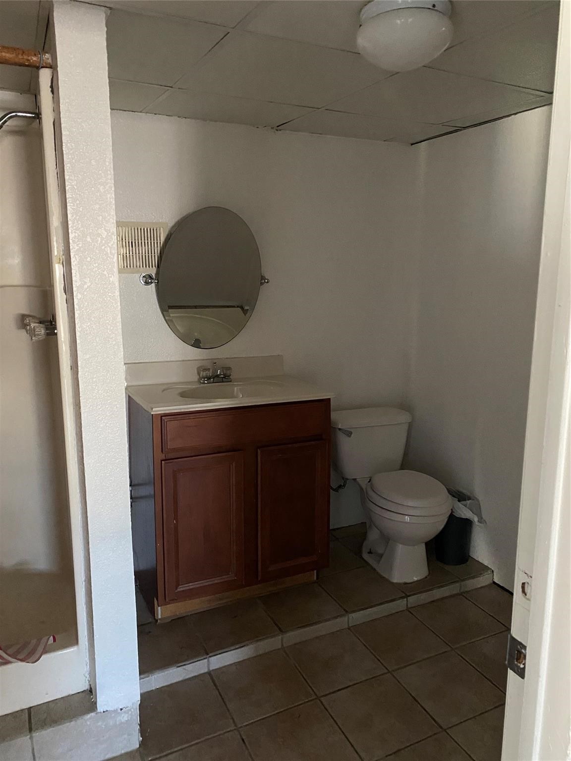 3427 Federal Road Pasadena, TX 77504 - Photo 6 of 17 a bathroom with a toilet and a mirror