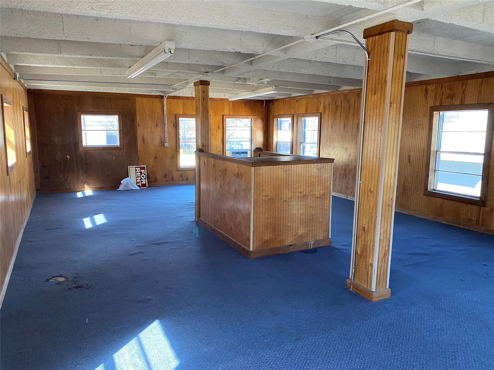 3427 Federal Road Pasadena, TX 77504 - Photo 10 of 17 an empty room with wooden floor and windows