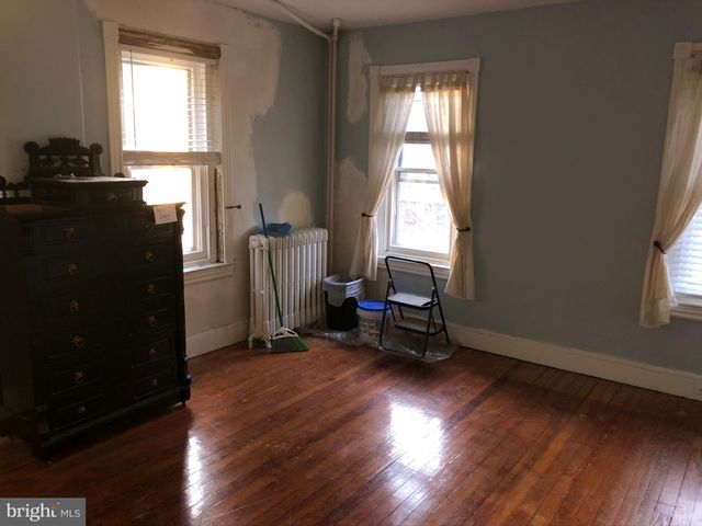 a kitchen with a refrigerator and a window