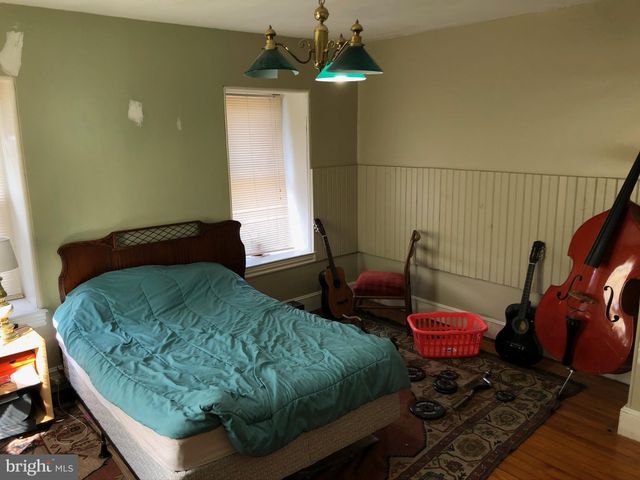 a room with furniture and wooden floor