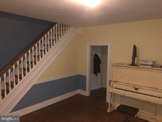 a kitchen with a refrigerator stove and cabinets