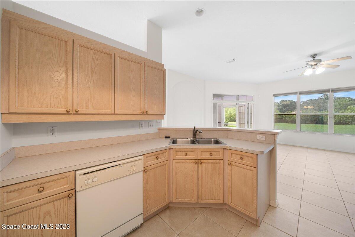 853 Villa Drive Melbourne, FL 32940 - Photo 12 of 28 a kitchen with a sink and cabinets