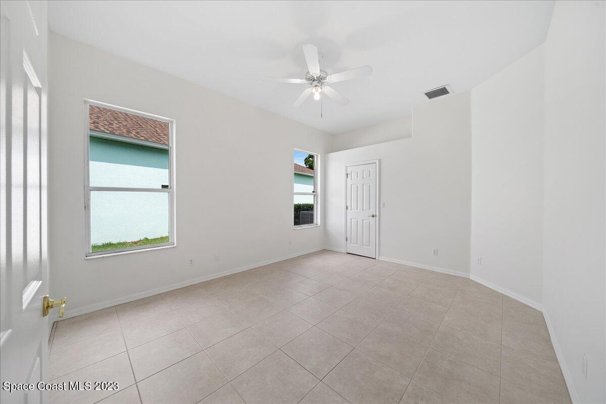 853 Villa Drive Melbourne, FL 32940 - Photo 17 of 28 an empty room with windows and closet