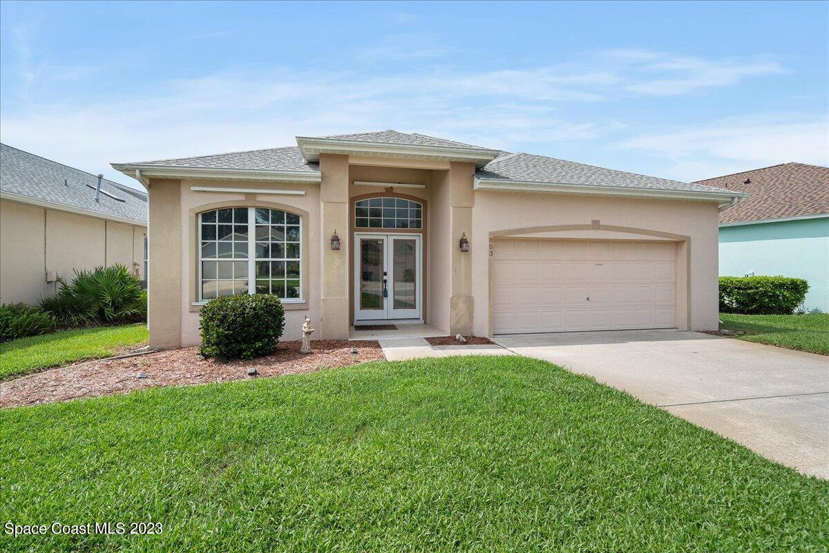 853 Villa Drive Melbourne, FL 32940 - Photo 2 of 28 front view of a house with a yard