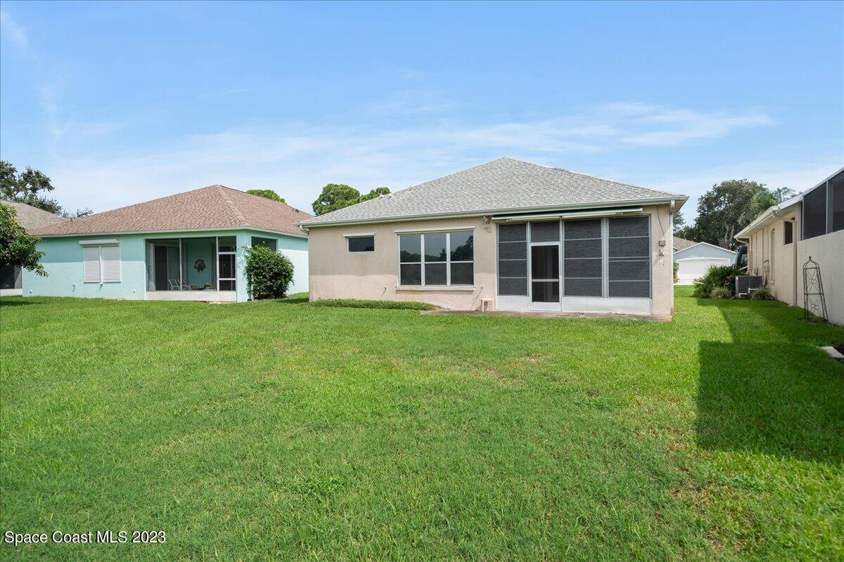 853 Villa Drive Melbourne, FL 32940 - Photo 28 of 28 a front view of a house with a garden