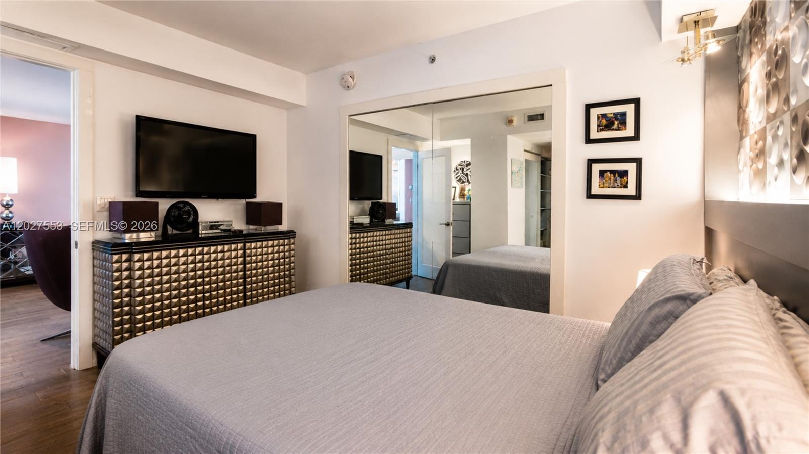 100 Lincoln Road, Unit 533 Miami Beach, FL 33139 - Photo 12 of 26 a bedroom with a bed and a flat screen tv