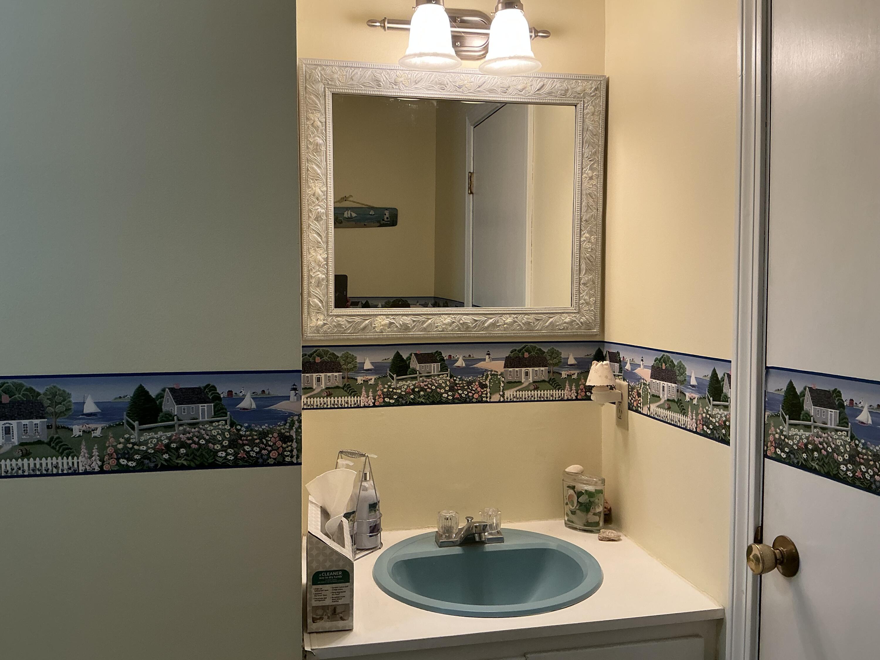 29 Windshore Drive Hyannis, MA 02601 - Photo 11 of 32 a bathroom with a sink and a mirror
