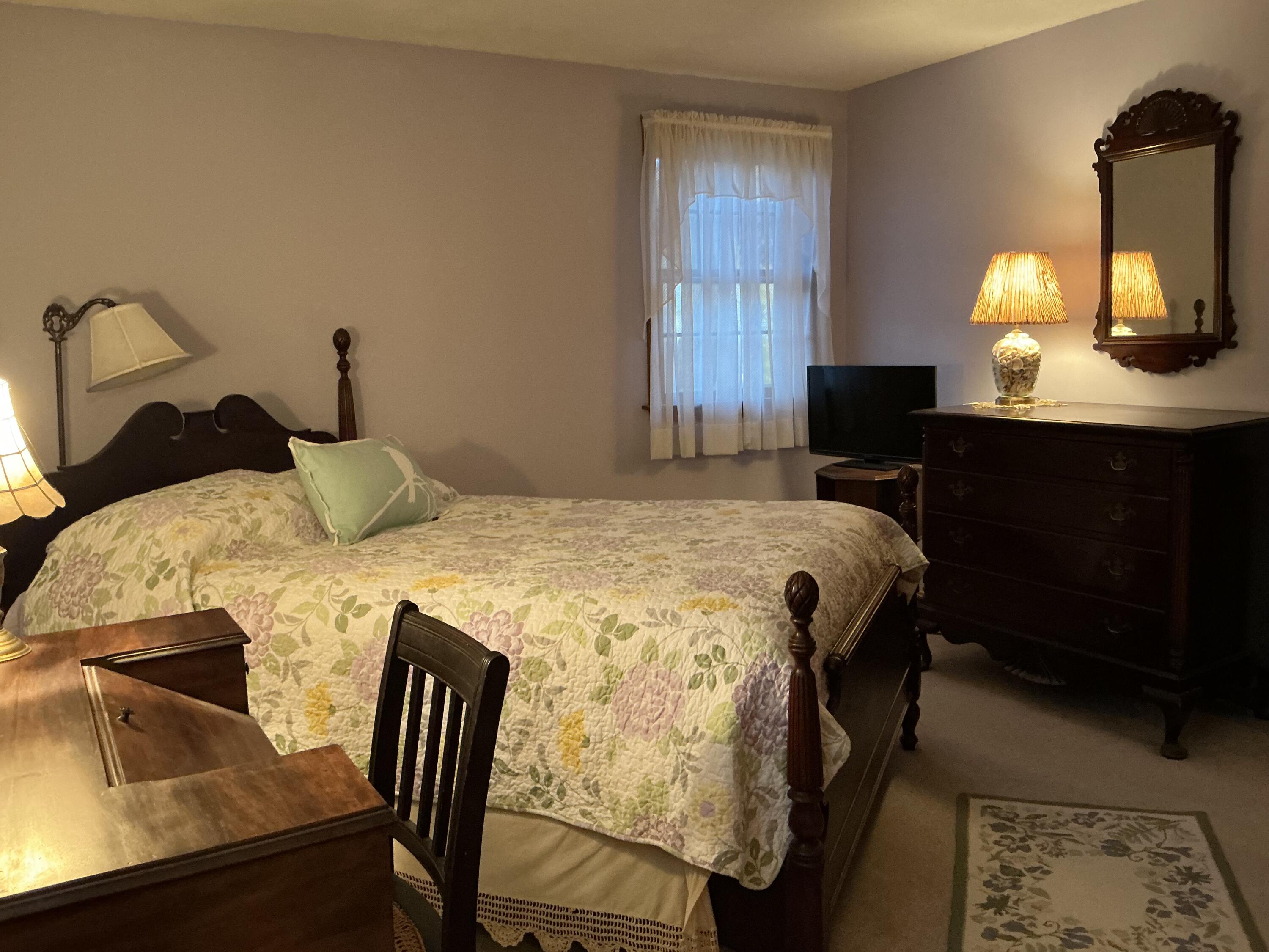 29 Windshore Drive Hyannis, MA 02601 - Photo 16 of 32 a bedroom with a bed and a table