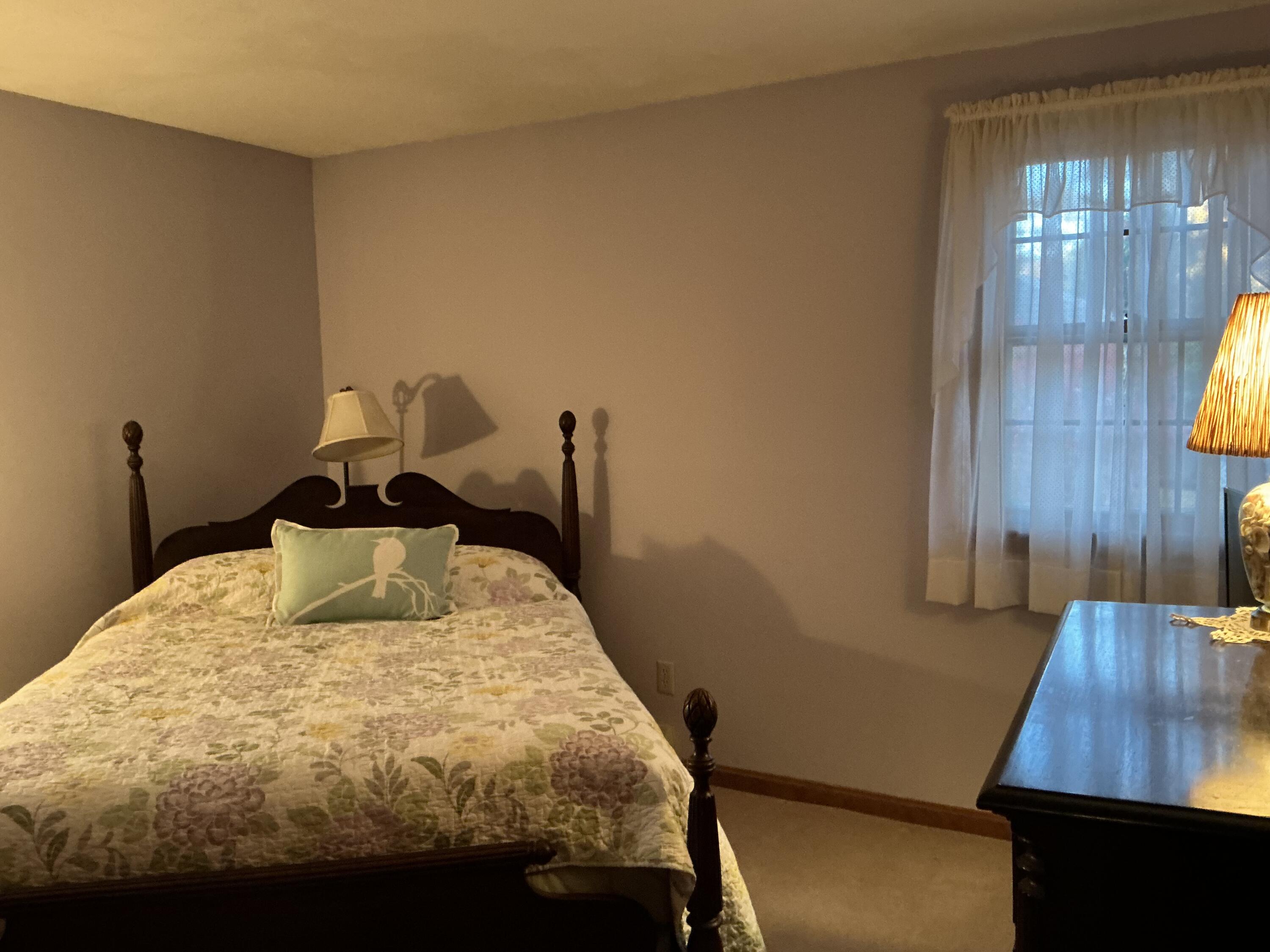 29 Windshore Drive Hyannis, MA 02601 - Photo 17 of 32 a bed sitting in a bedroom next to a window