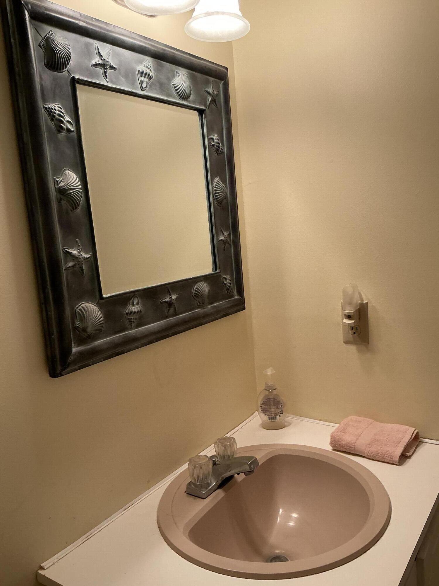 29 Windshore Drive Hyannis, MA 02601 - Photo 19 of 32 a bathroom with a sink and mirror