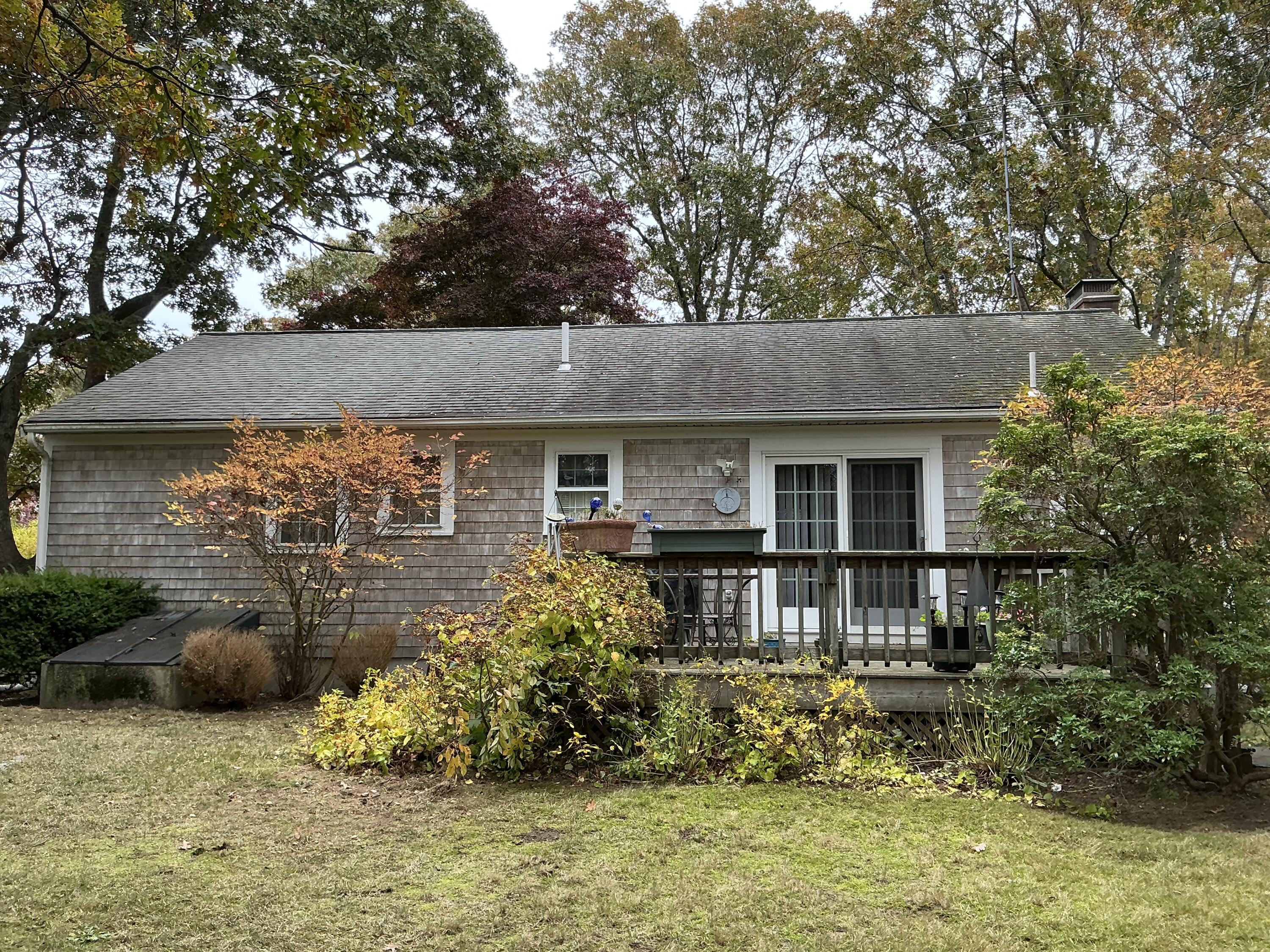 29 Windshore Drive Hyannis, MA 02601 - Photo 23 of 32 a front view of a house with a yard garage and outdoor seating