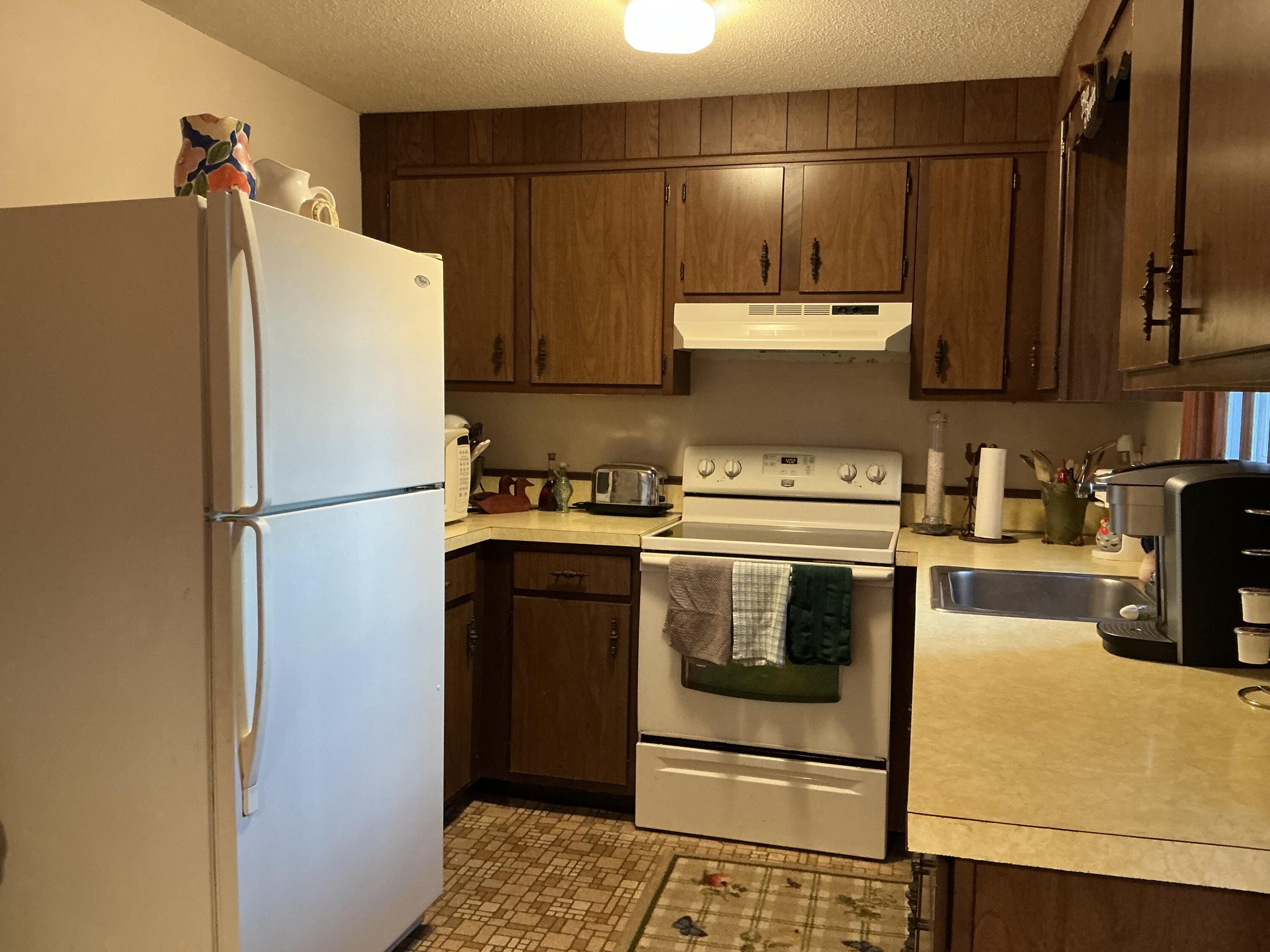 29 Windshore Drive Hyannis, MA 02601 - Photo 8 of 32 a kitchen with a refrigerator and a stove