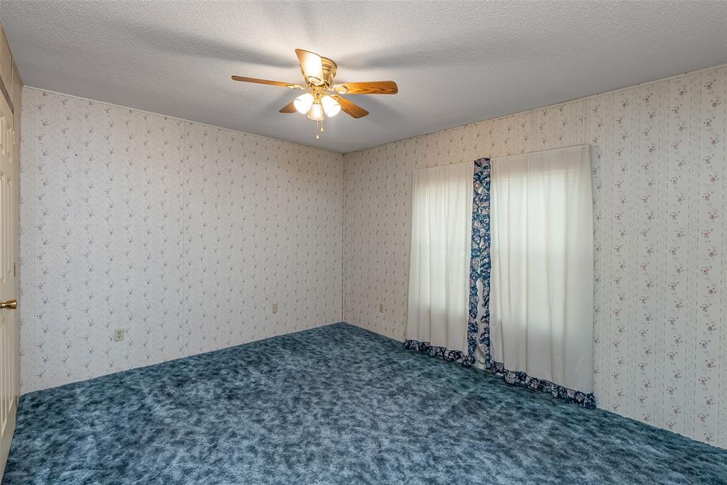 121 Woolworth Road Stonewall, LA 71078 - Photo 18 of 32 an empty room with chandelier fan