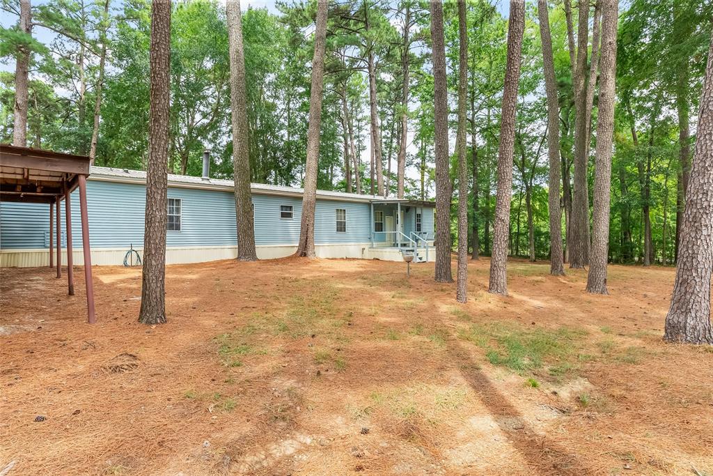 121 Woolworth Road Stonewall, LA 71078 - Photo 25 of 32 a view of a house with backyard and trees