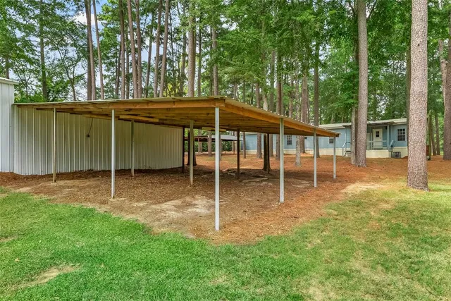 a backyard of a house with lots of green space